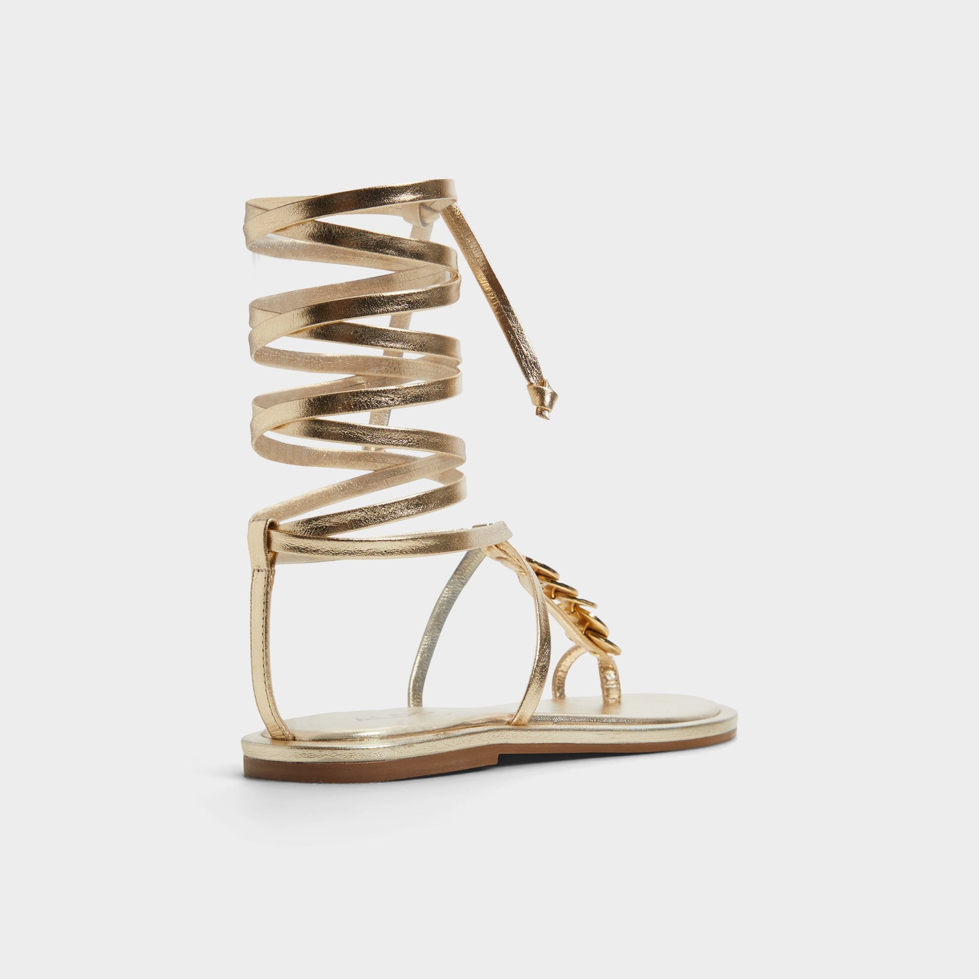 Three-quarter angle of Gold Artemisa T-strap sandal's back side