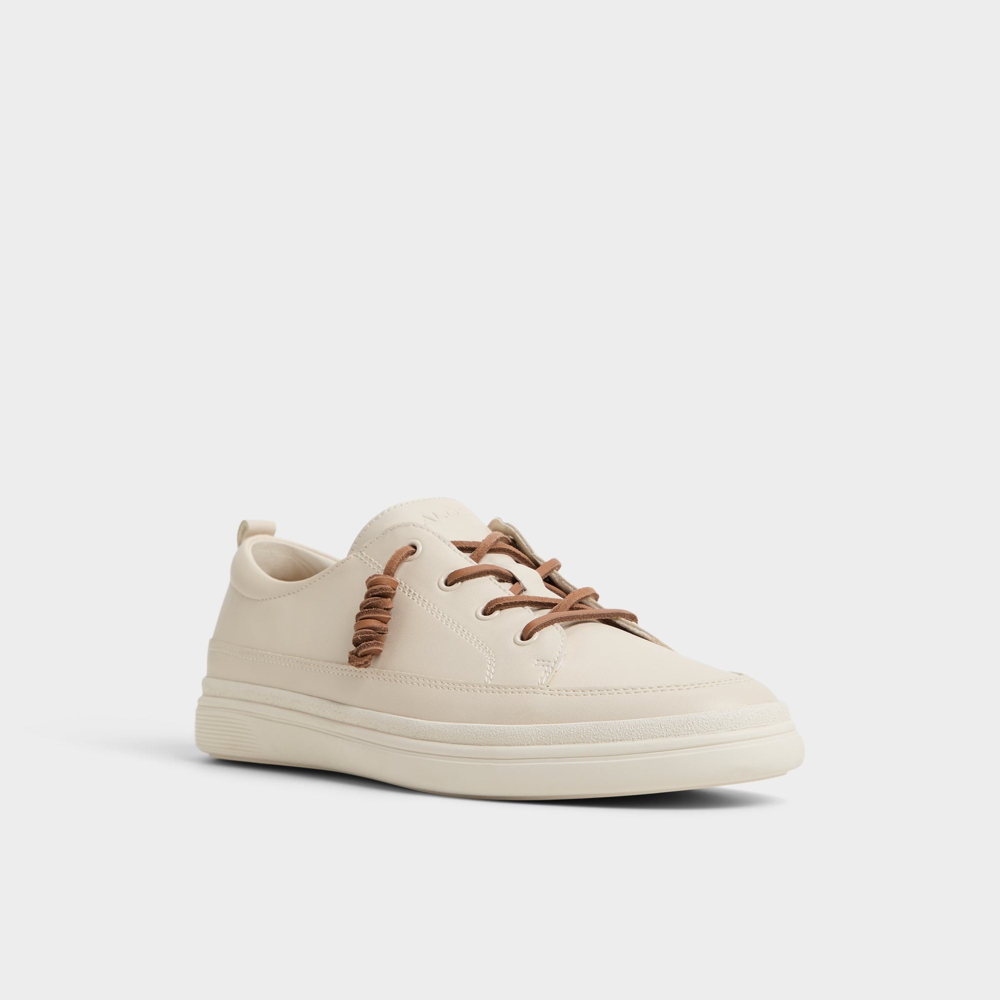 Three-quarter angle of White/Bone Tristin Low top sneaker's front side