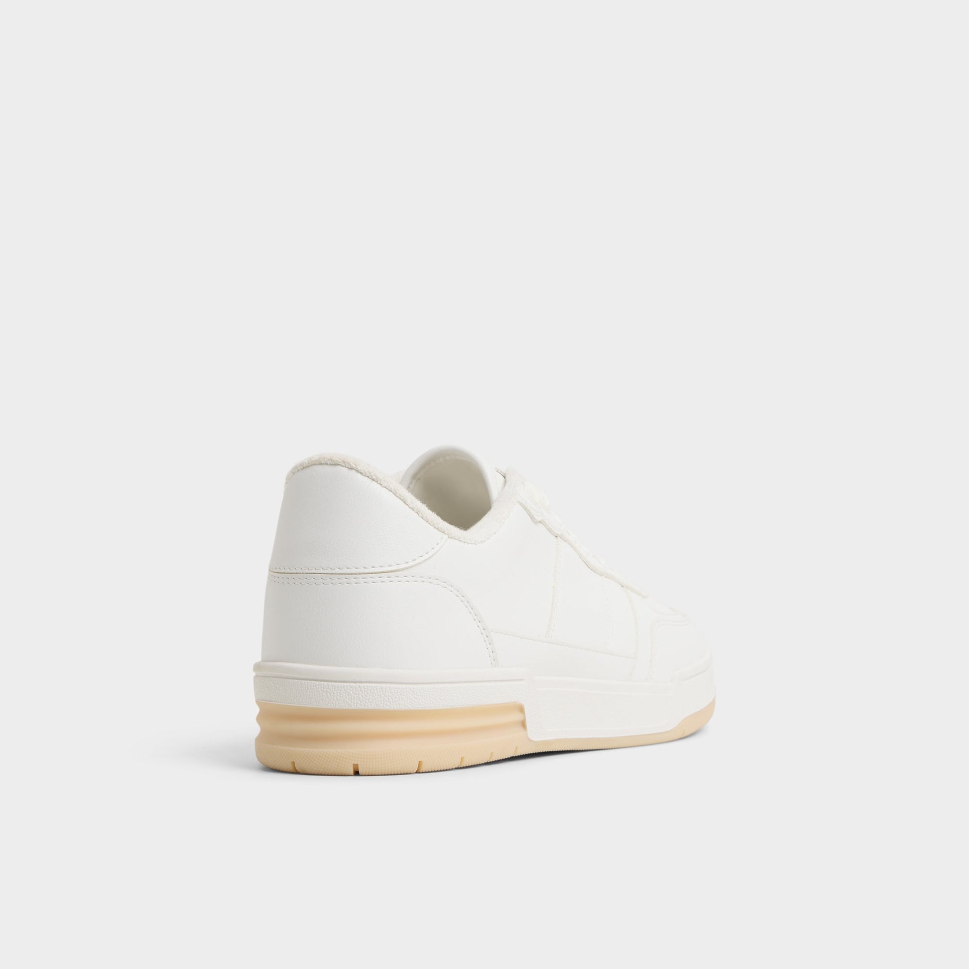 Three-quarter angle of White Topper Low top sneaker's back side