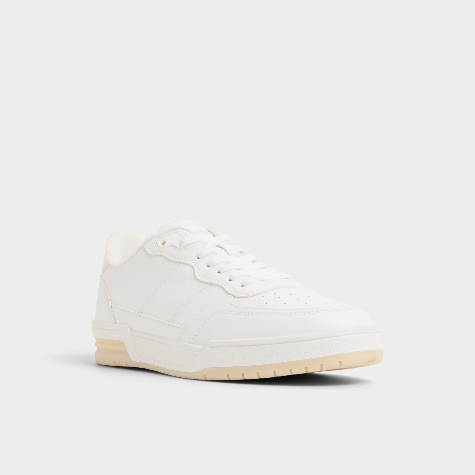 Three-quarter angle of White Topper Low top sneaker's front side