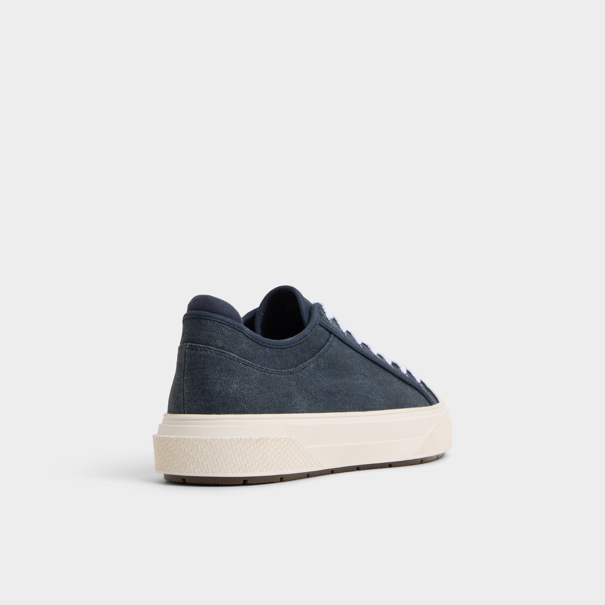Three-quarter angle of Navy Colin Low top sneaker's back side