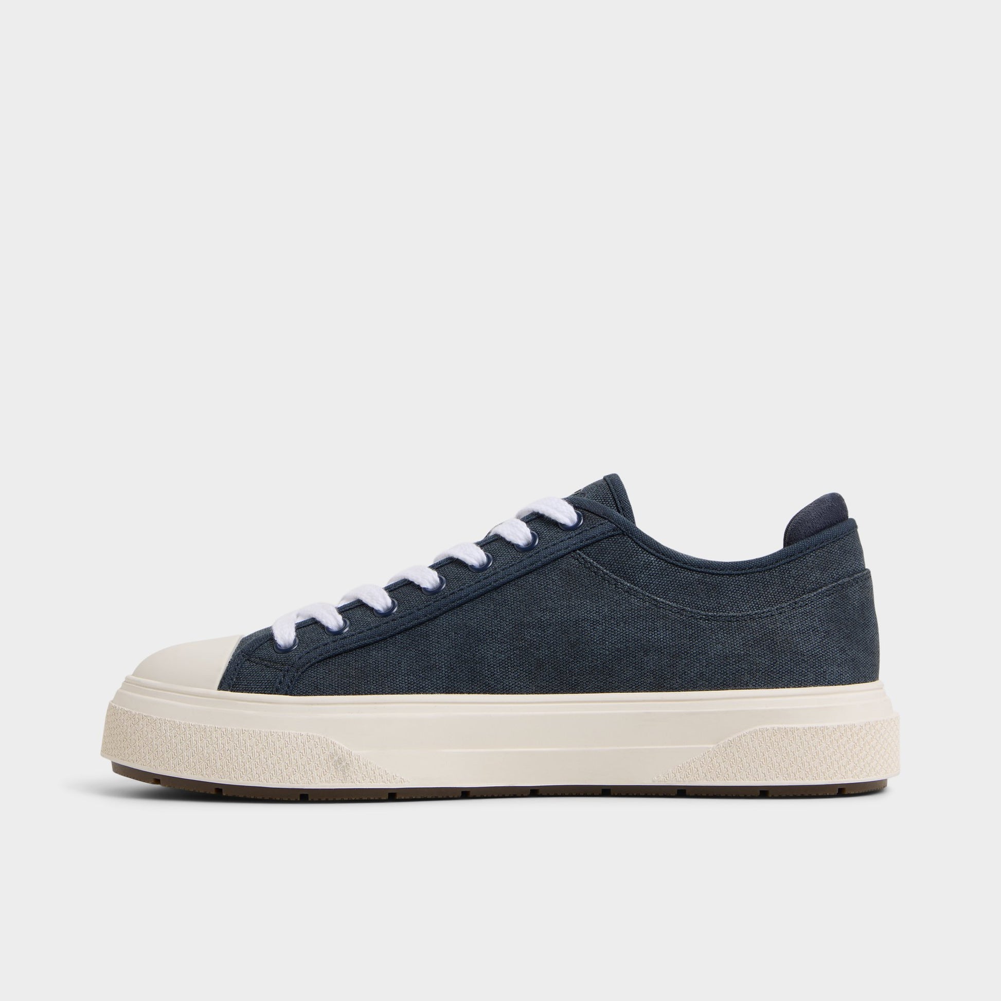 Side view of Navy Colin Low top sneaker