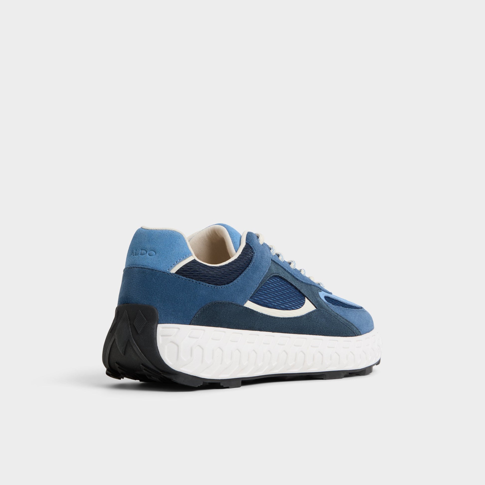 Three-quarter angle of Navy Stryker Low top sneaker's back side