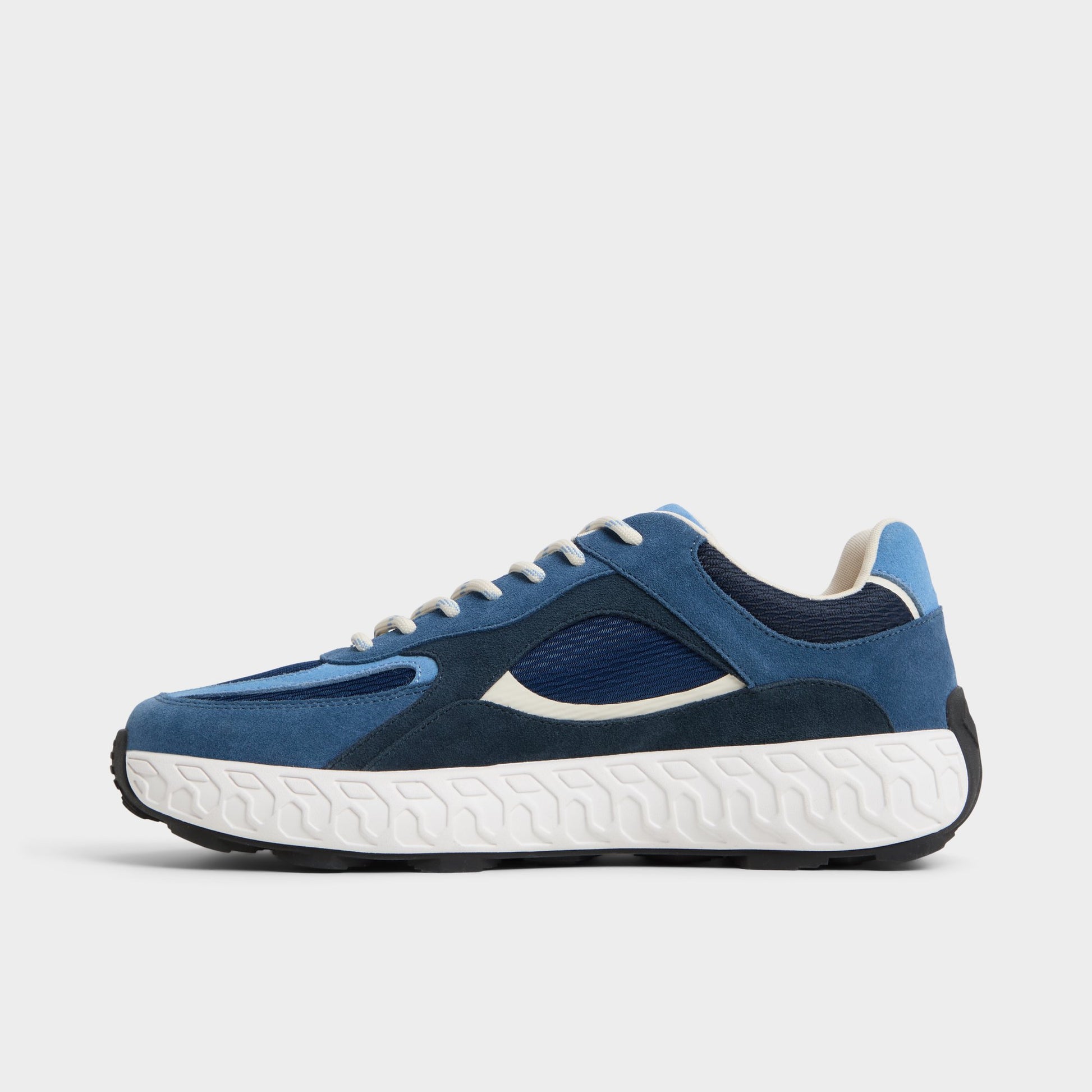 Side view of Navy Stryker Low top sneaker