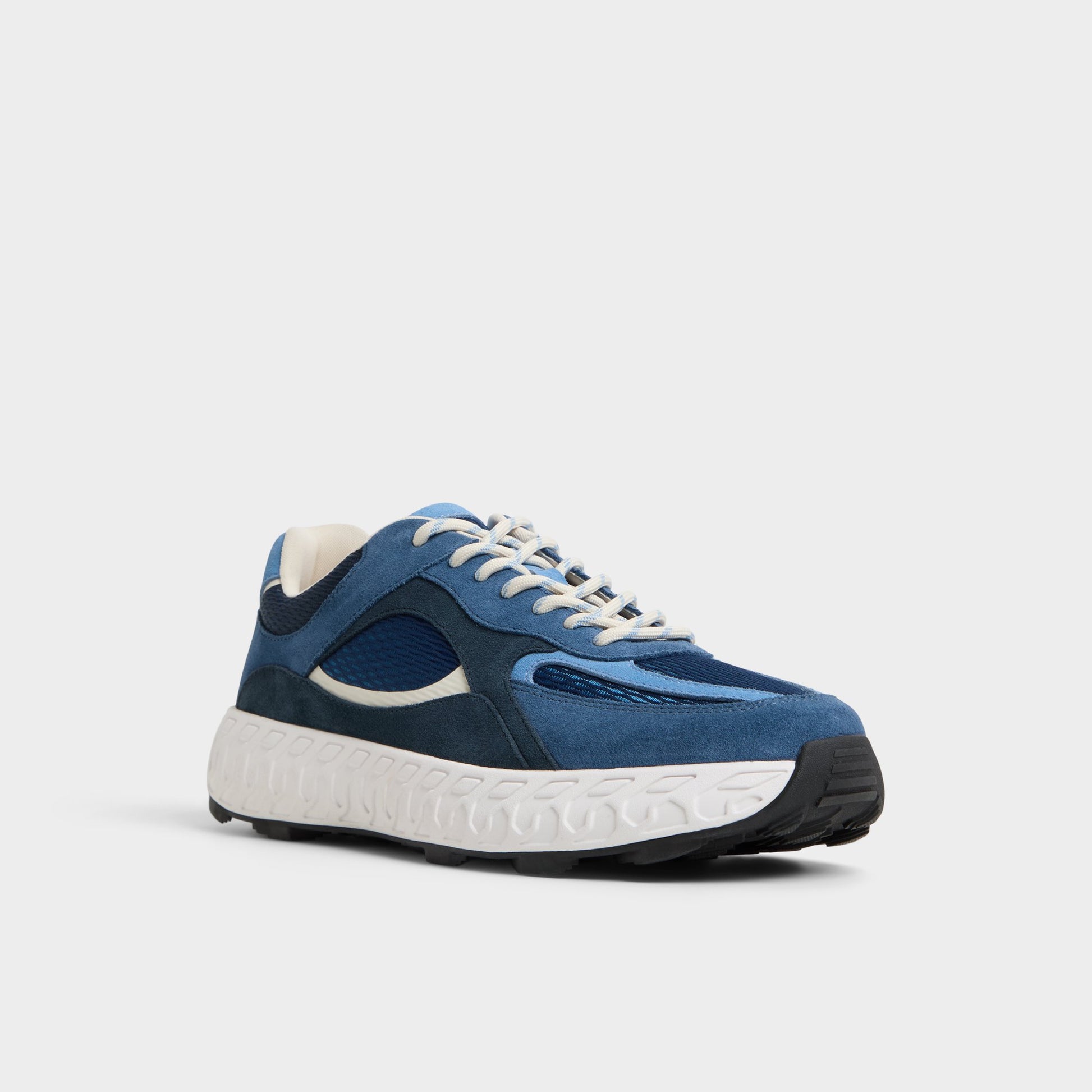 Three-quarter angle of Navy Stryker Low top sneaker's front side