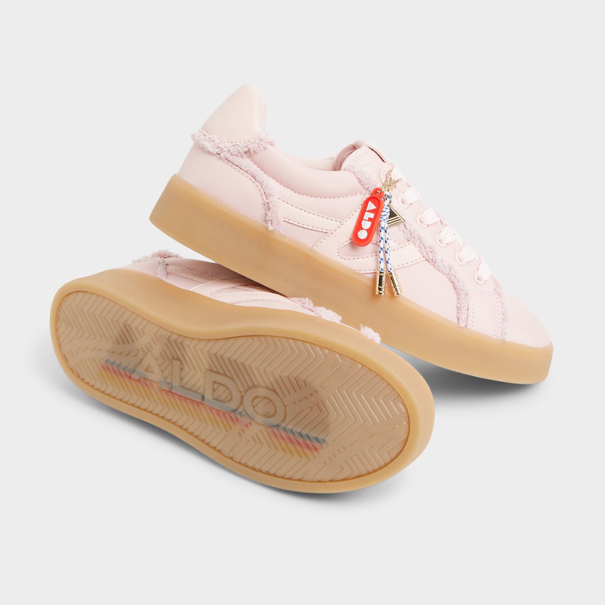 Highlighted view of a pair of Light pink Mtl1972snkr-l Low top sneakers