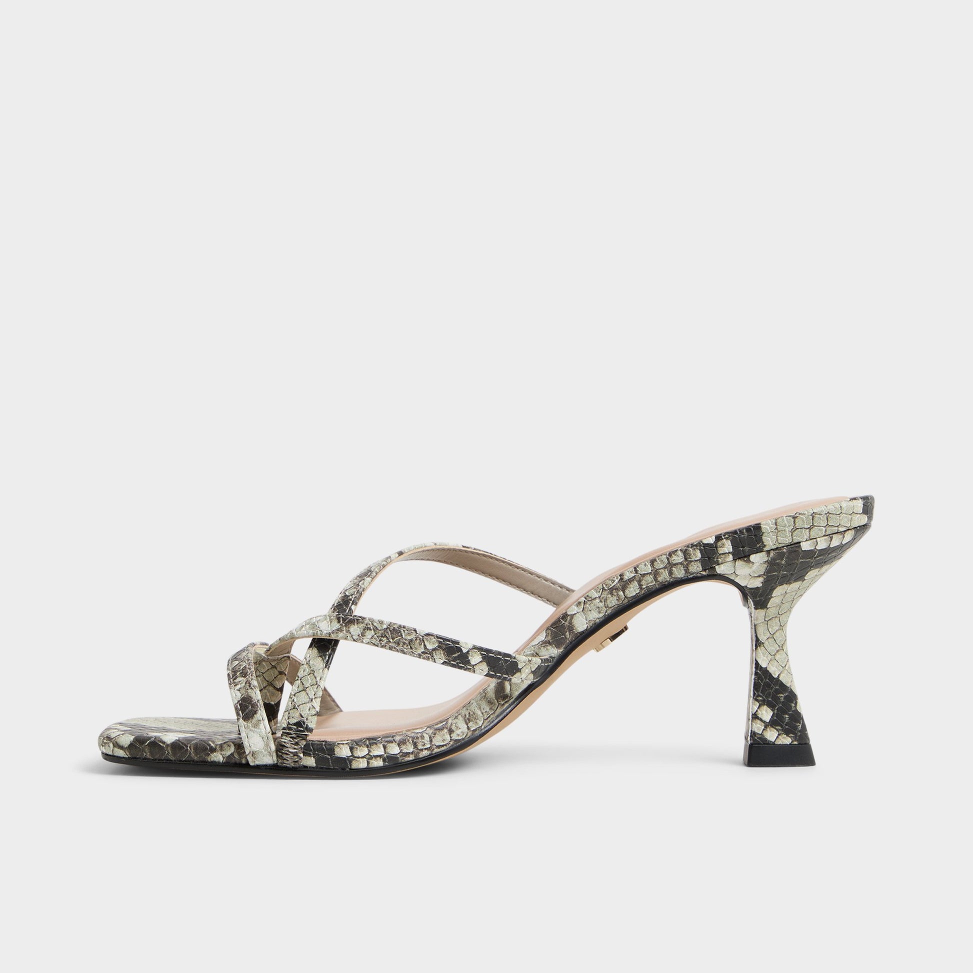 Side view of White/Black Calypsa Strappy heeled sandal