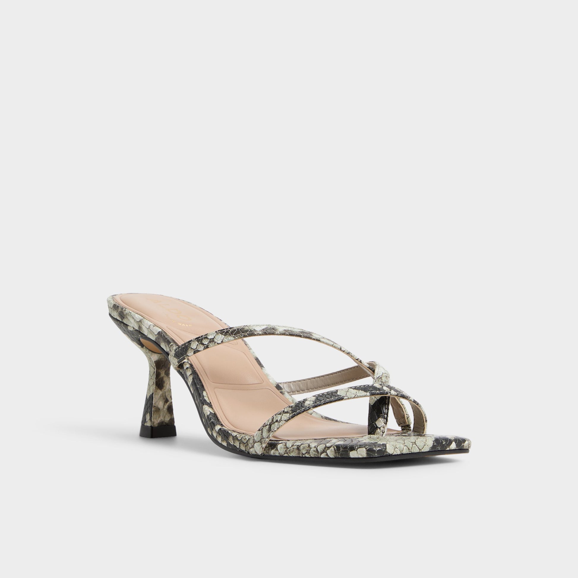 Three-quarter angle of White/Black Calypsa Strappy heeled sandal's front side