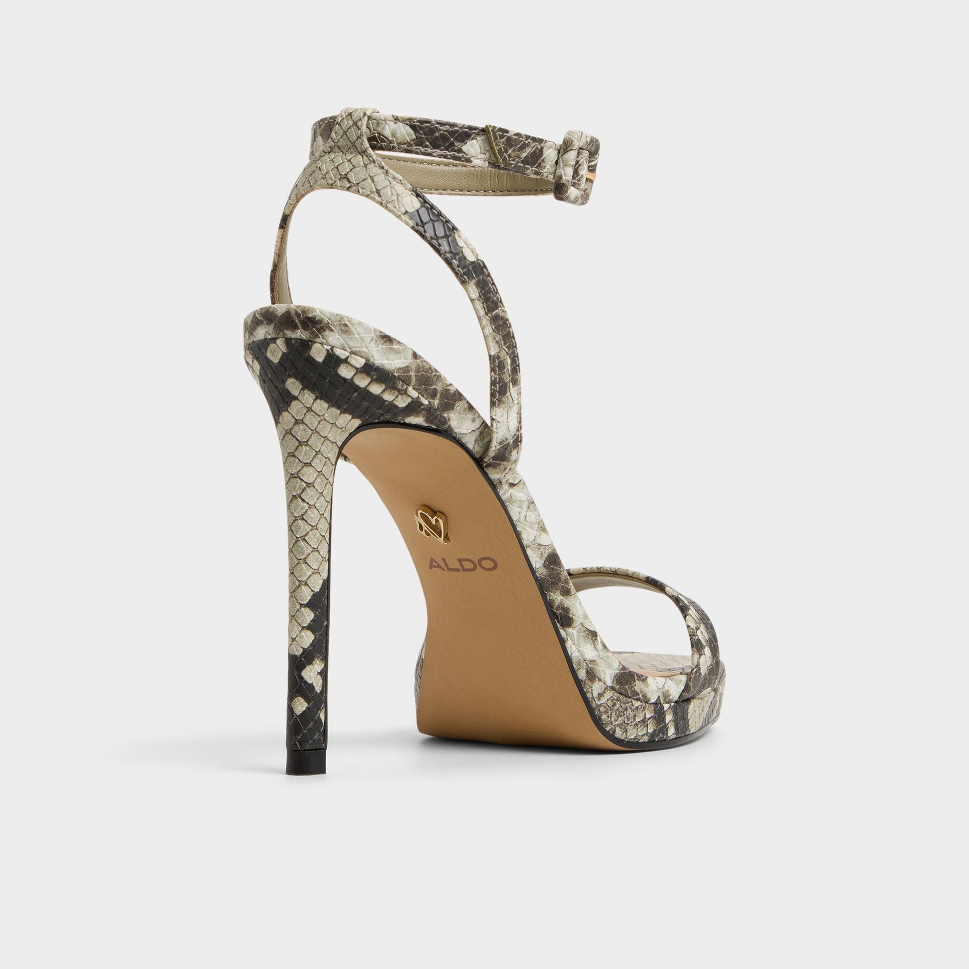 Three-quarter angle of White/Black Kaathy Strappy heeled sandal's back side