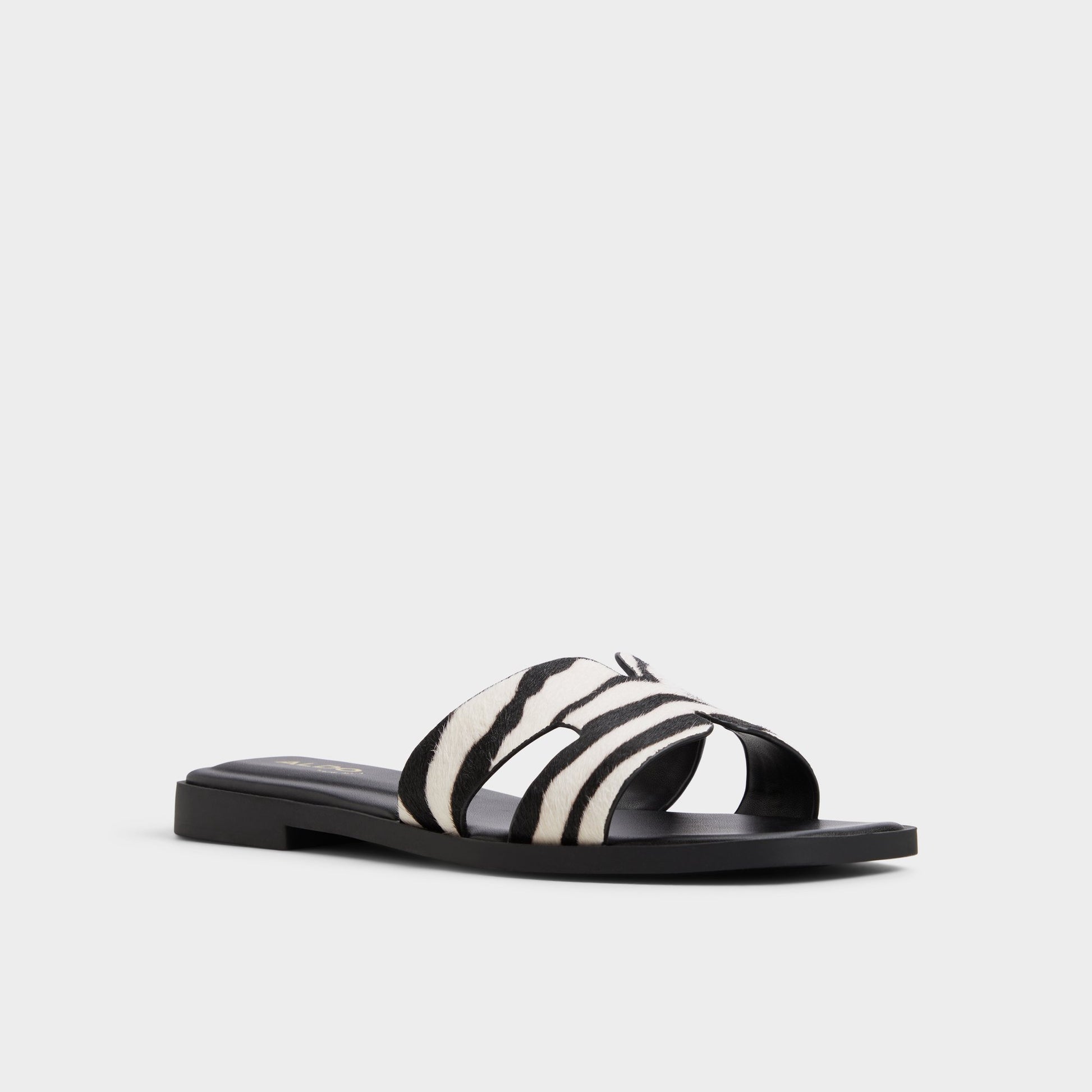 Three-quarter angle of White/Black Itsandal Slide sandal's front side