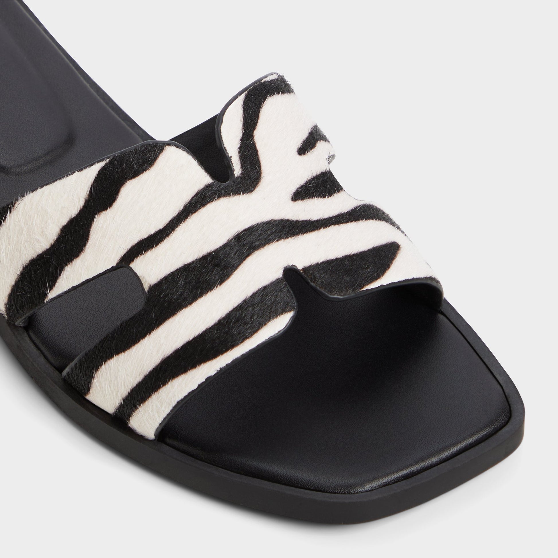 Close-up of the White/Black Itsandal Slide sandal