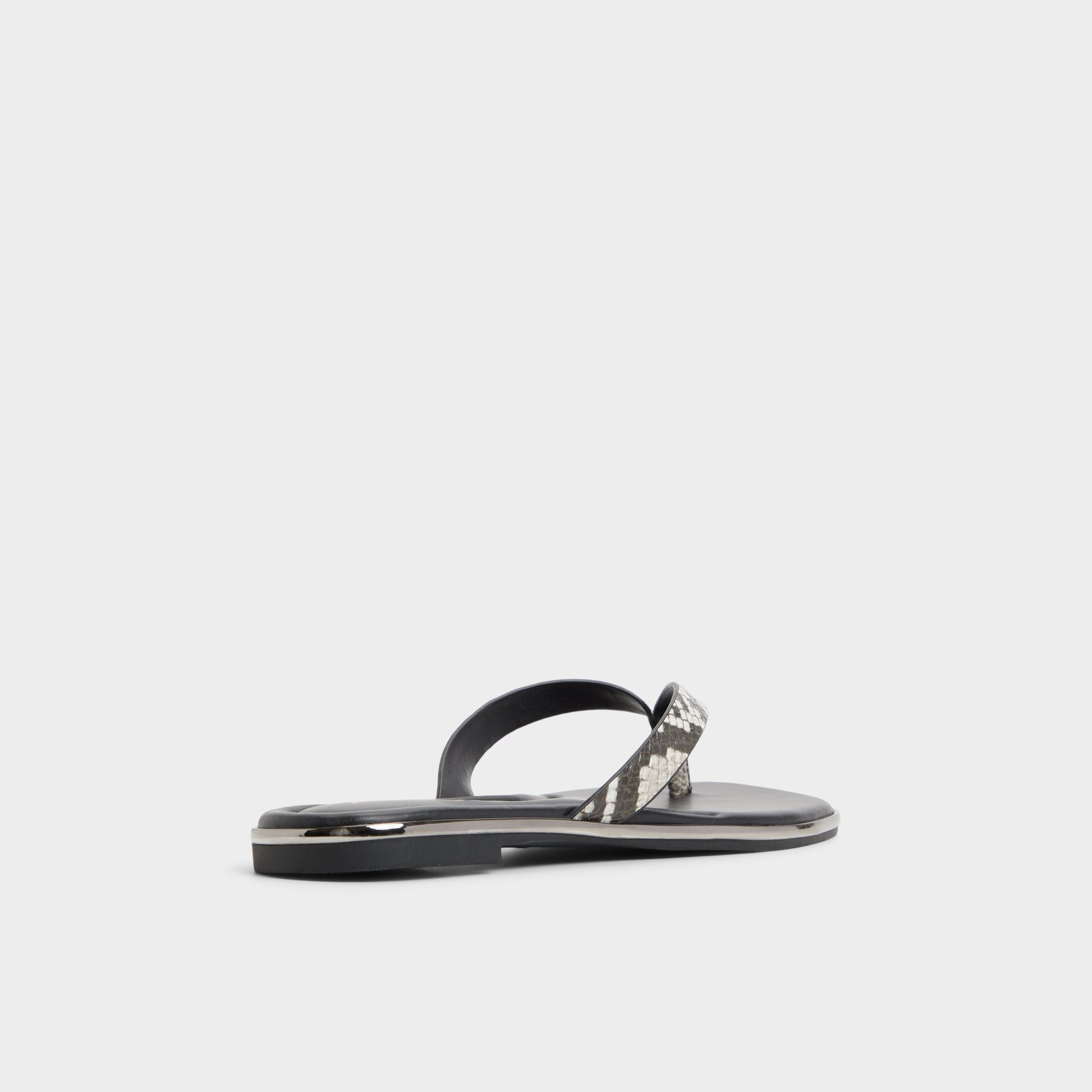 Three-quarter angle of White/Black Theao Flip flop's back side