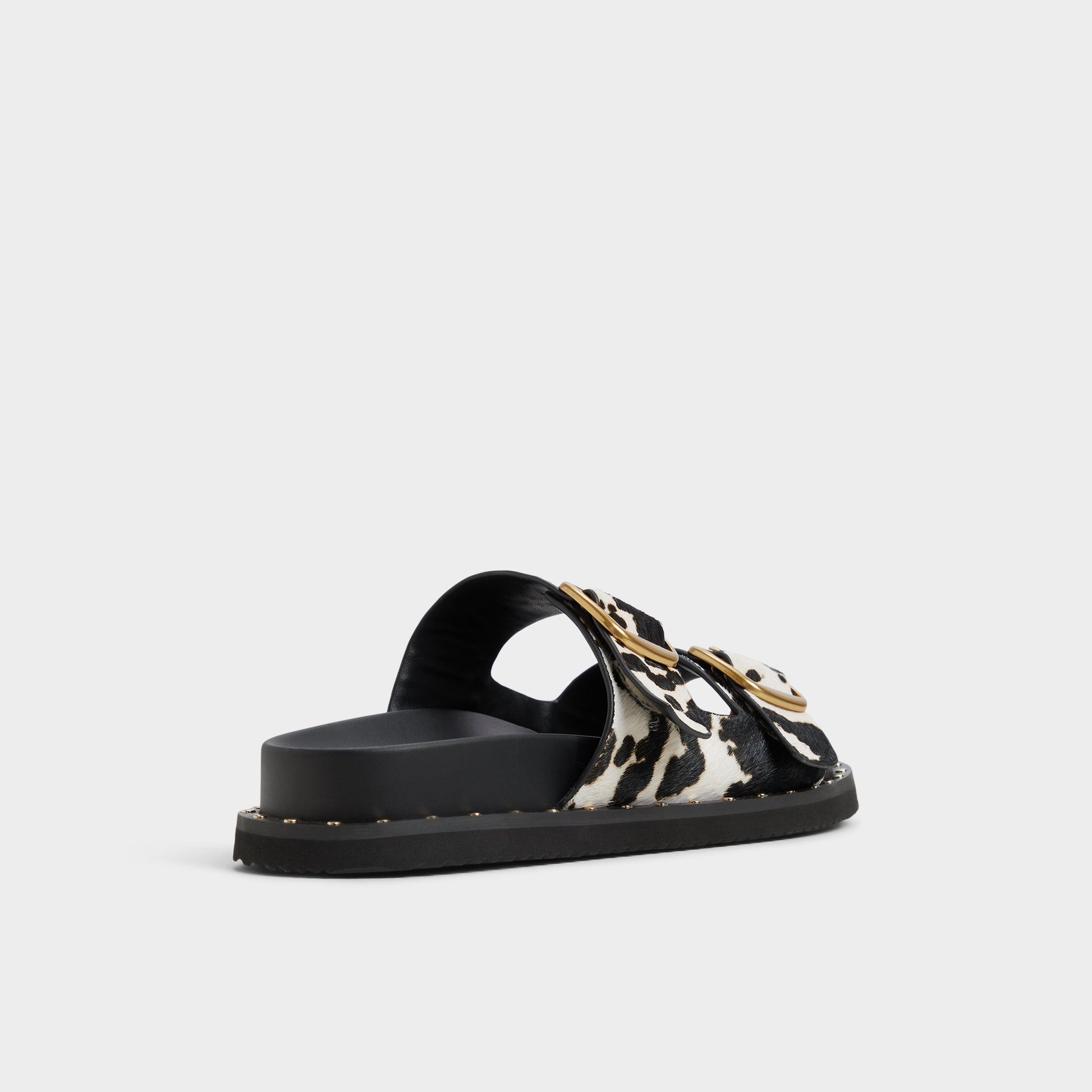 Three-quarter angle of White/Black Kravis Slide sandal's back side