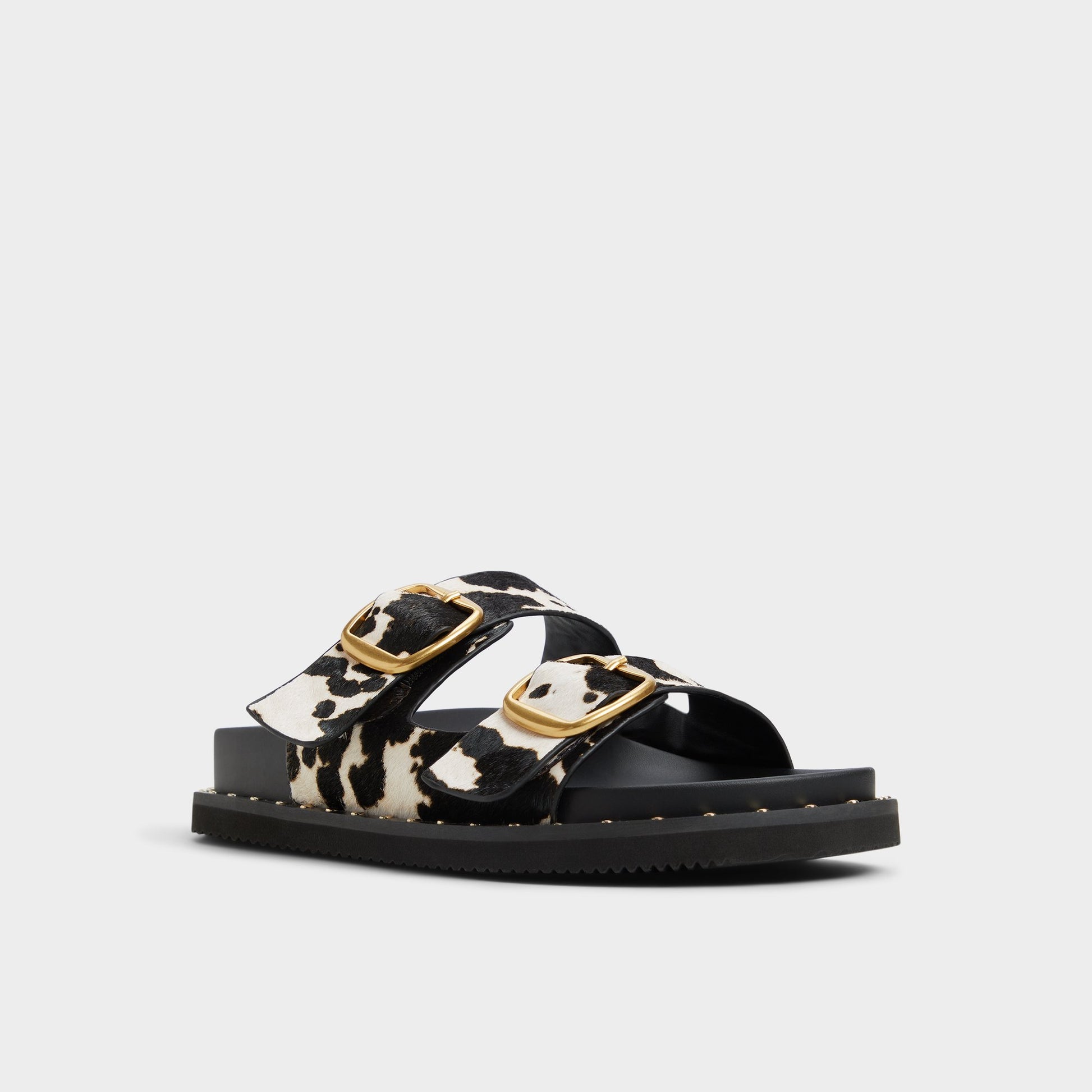 Three-quarter angle of White/Black Kravis Slide sandal's front side