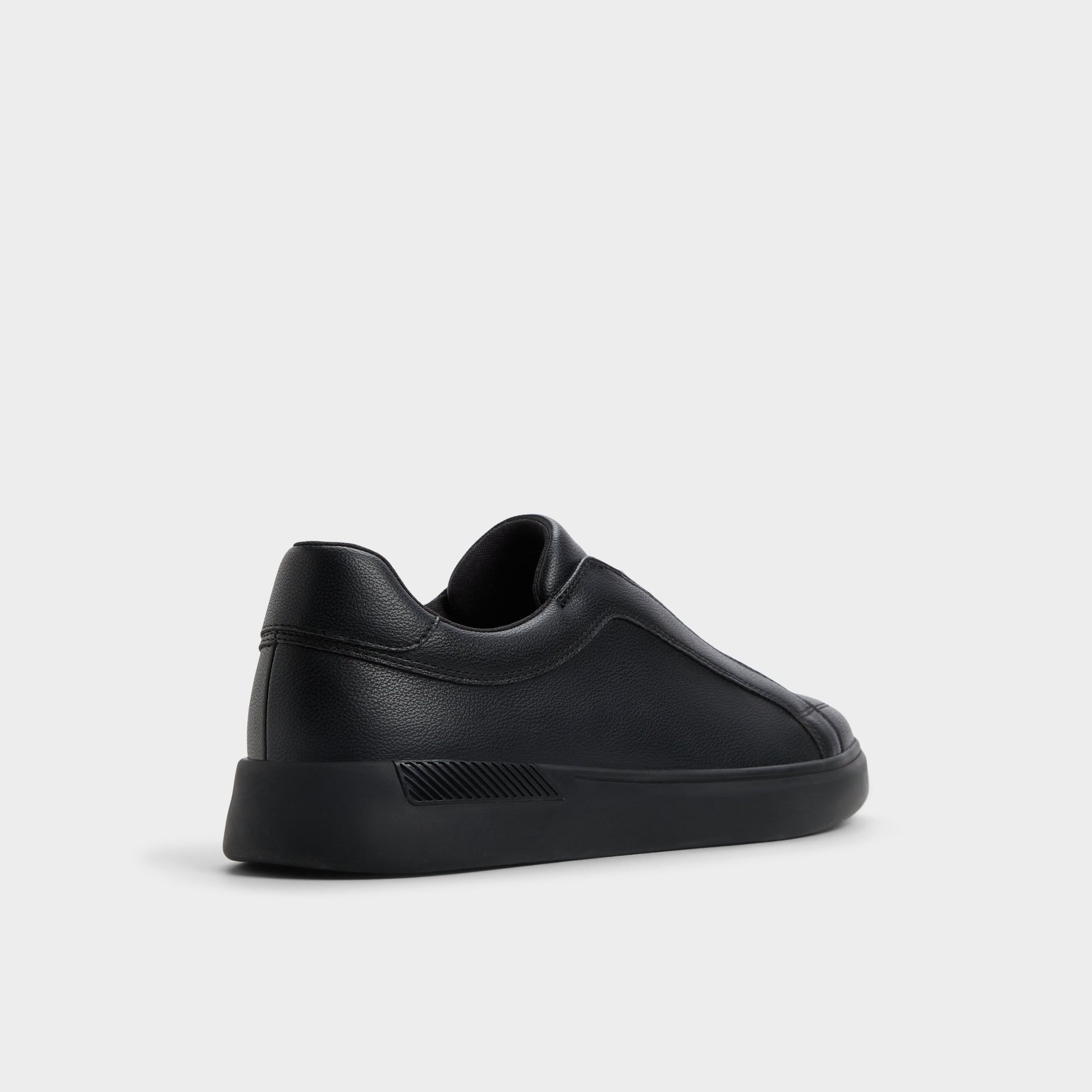 Three-quarter angle of Open Black Jona Slip-on sneaker's back side
