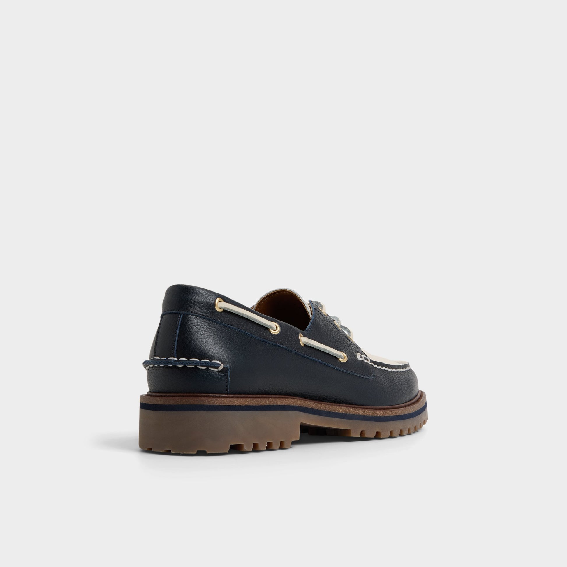 Three-quarter angle of Navy Cedric Boat shoe's back side