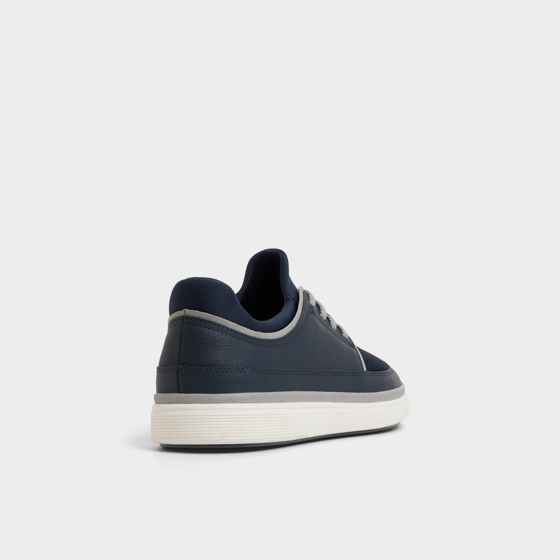 Three-quarter angle of Navy Kurtis Low top sneaker's back side