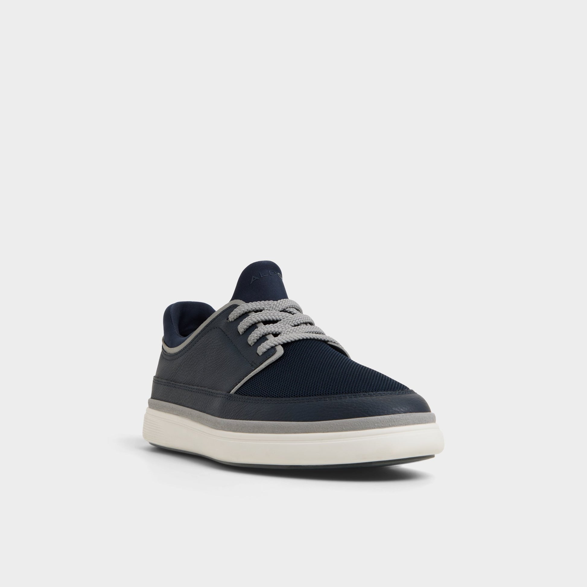 Three-quarter angle of Navy Kurtis Low top sneaker's front side