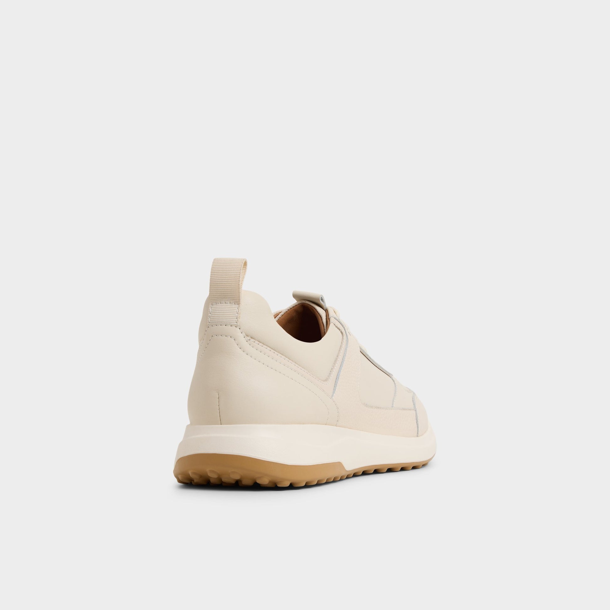 Three-quarter angle of Ivory Jeromy Jogger sneaker's back side