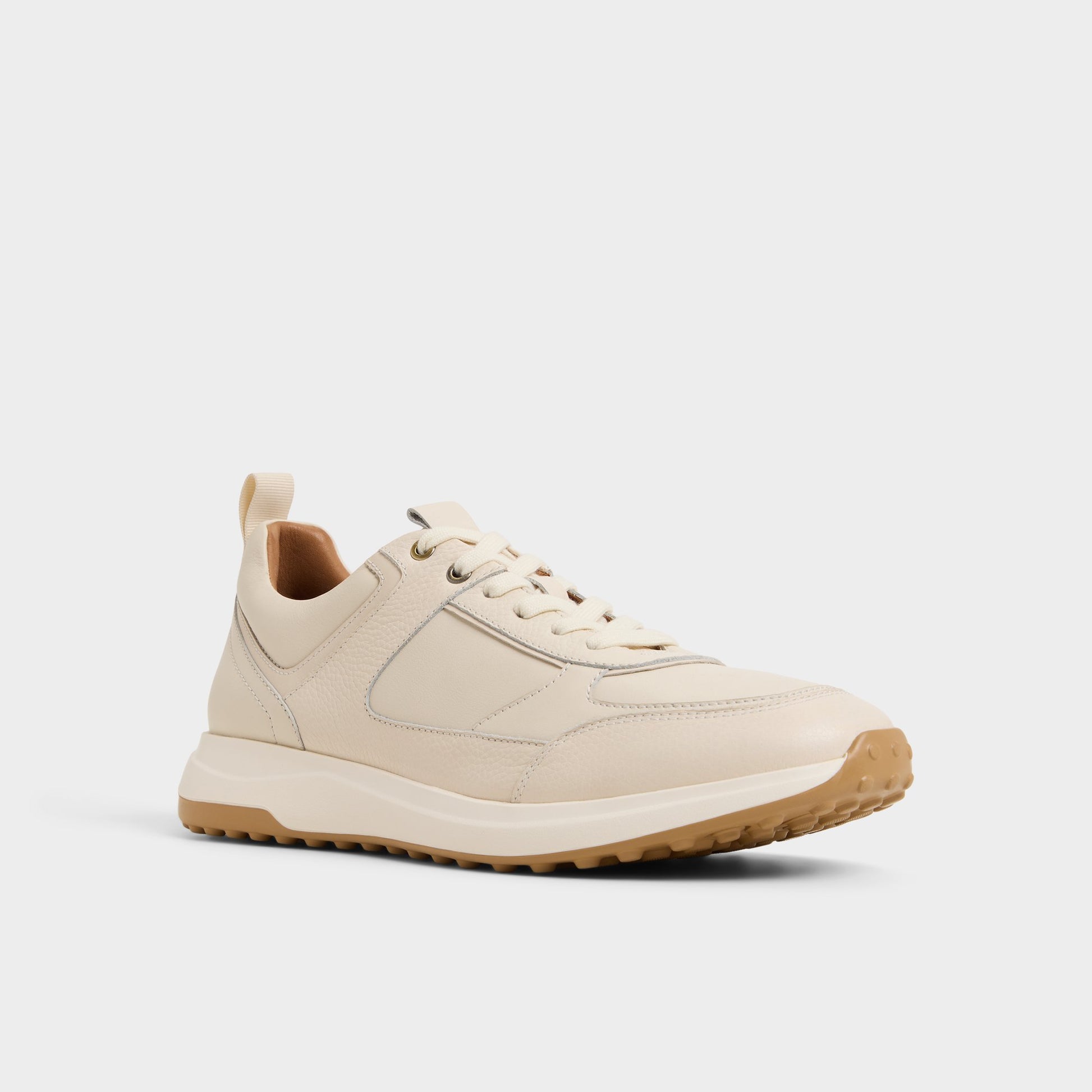 Three-quarter angle of Ivory Jeromy Jogger sneaker's front side