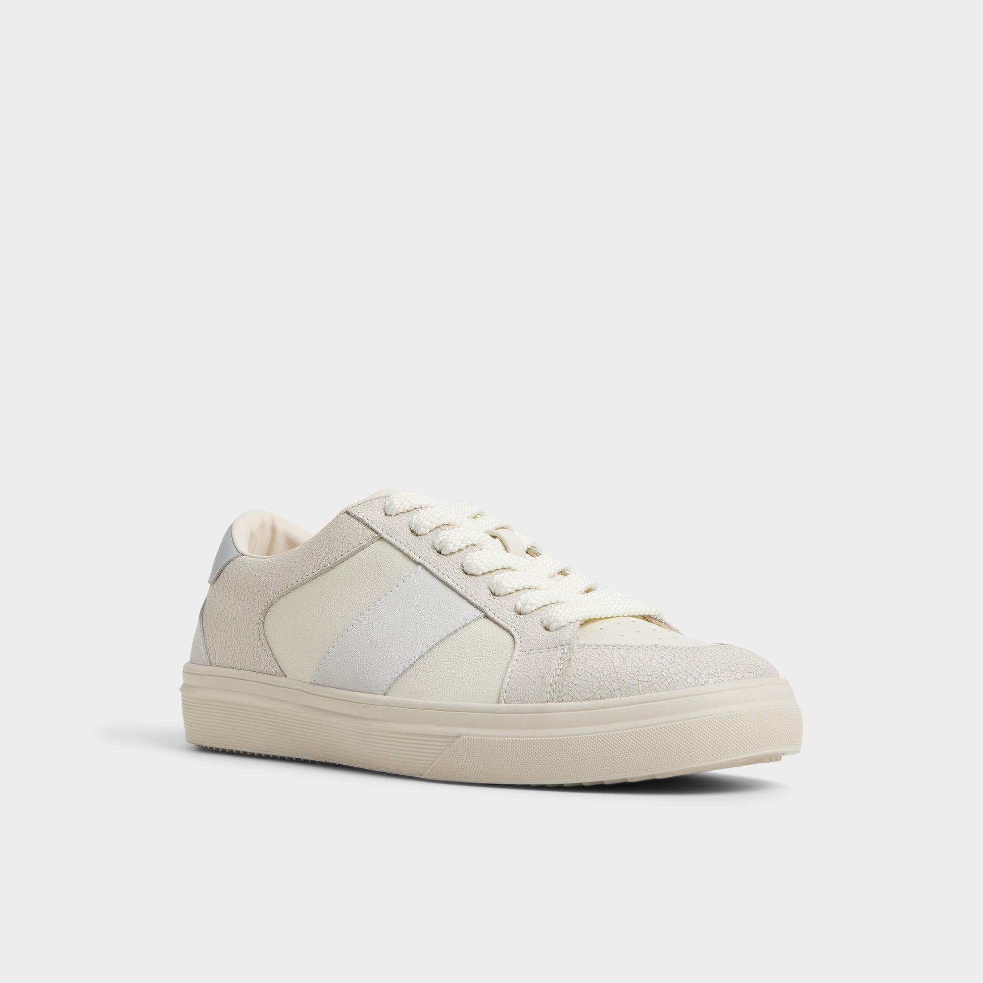 Three-quarter angle of White Braxton Low top sneaker's front side