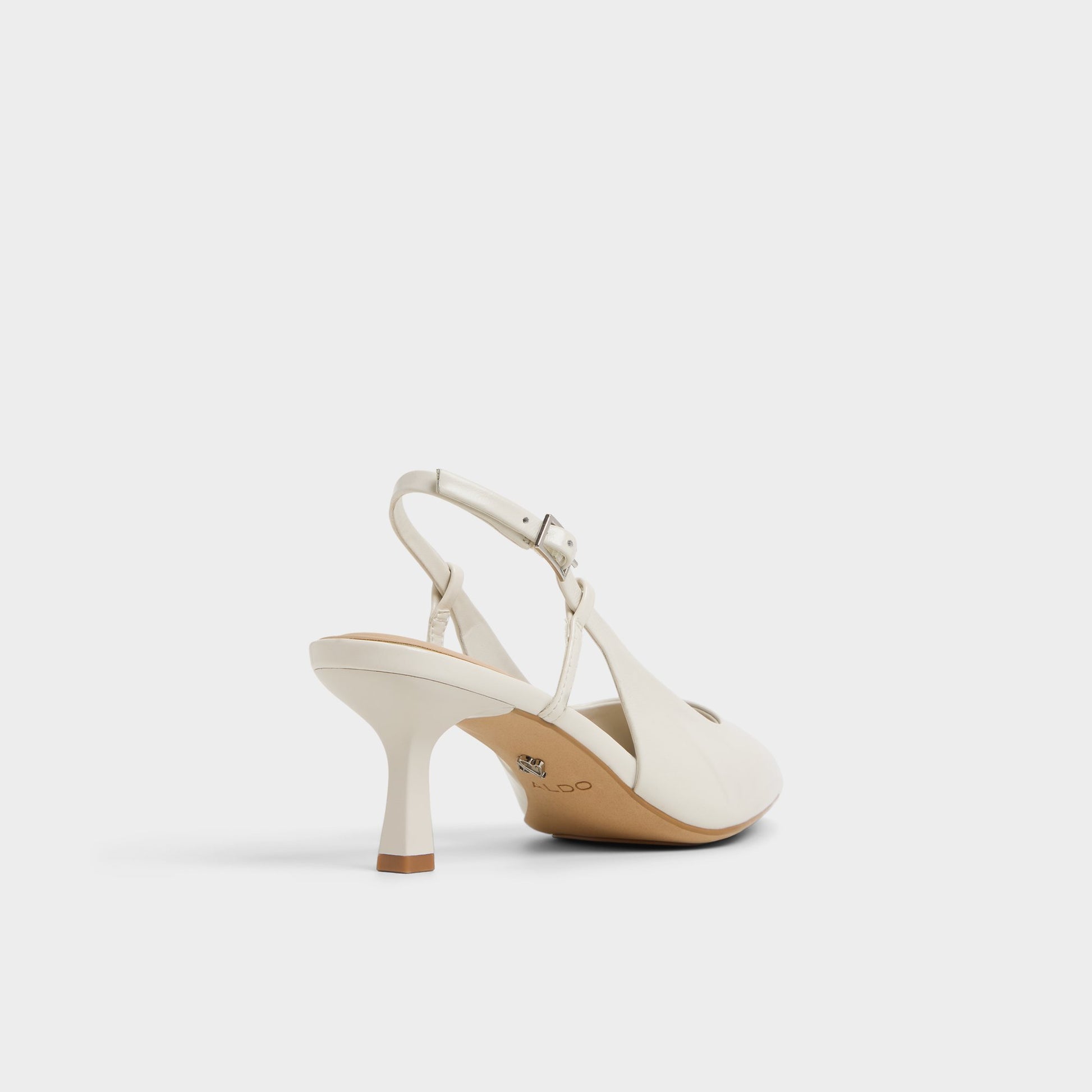 Three-quarter angle of White/Bone Adan Slingback heel's back side