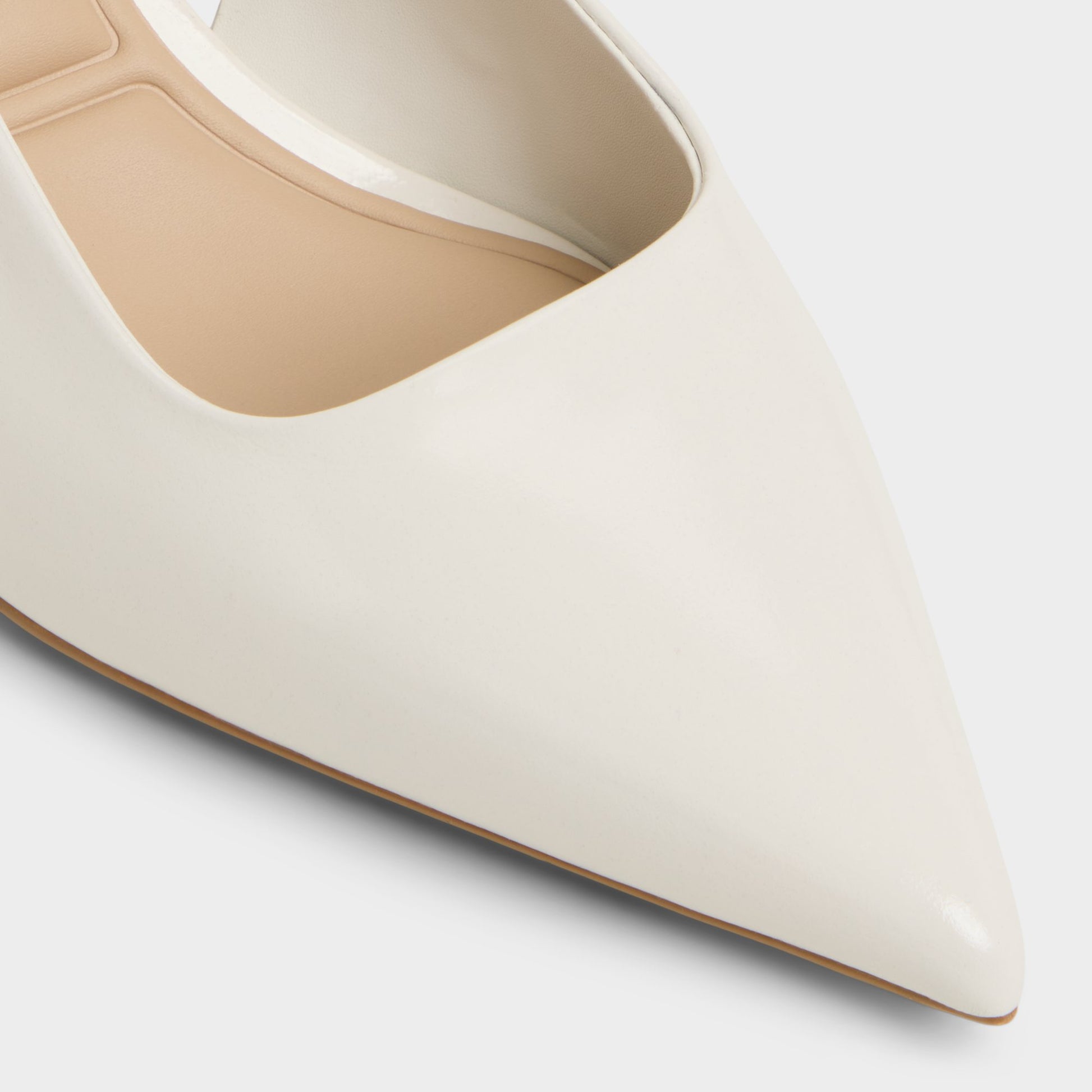 Close-up of the White/Bone Adan Slingback heel