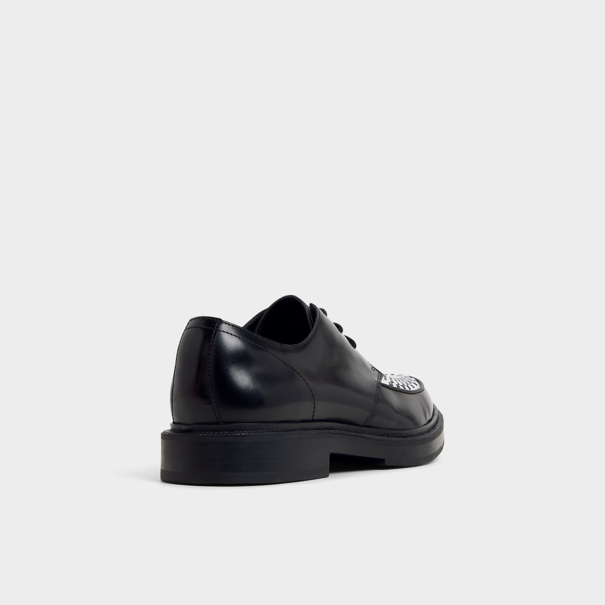 Three-quarter angle of Black/White Rocco Oxford shoe's back side