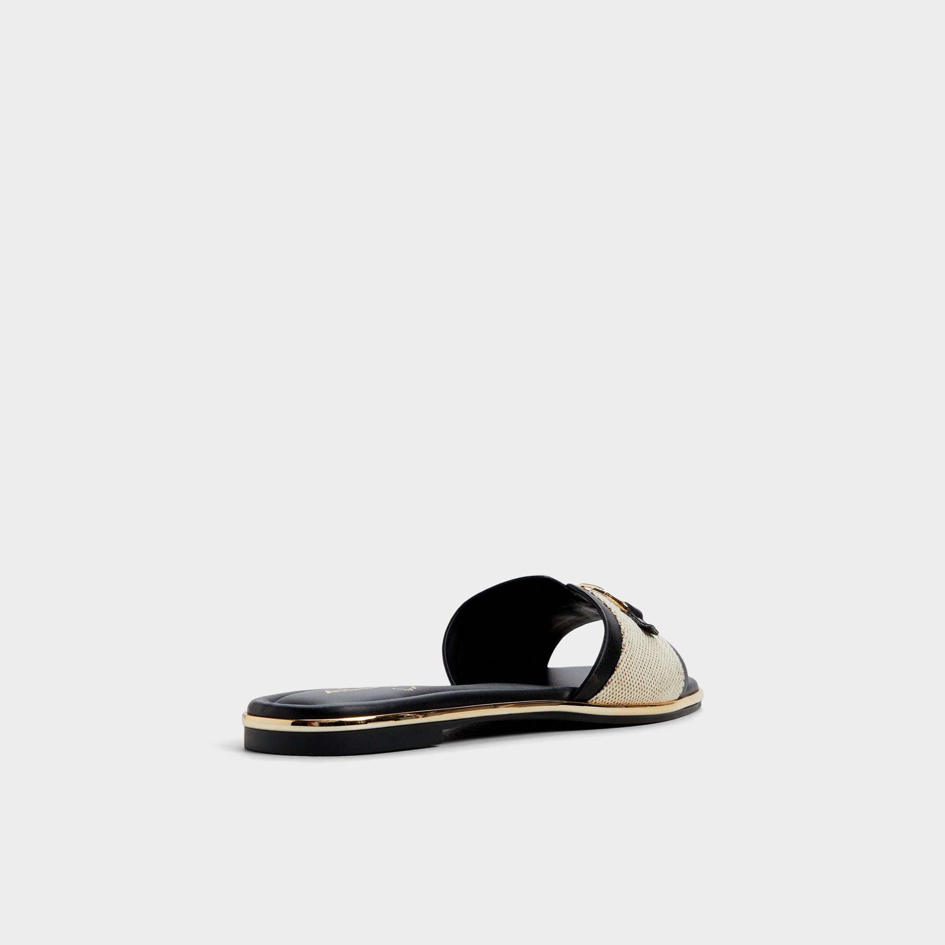 Three-quarter angle of Natural Alamassi Slide sandal's back side