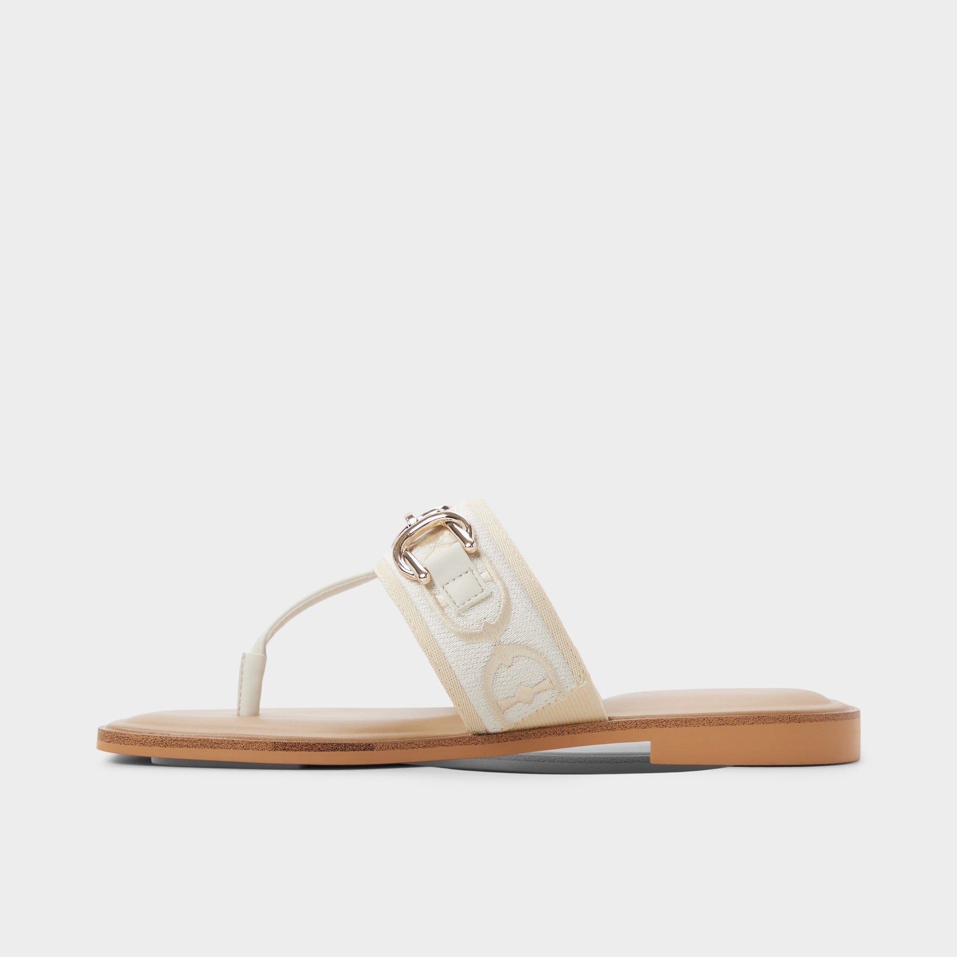 Side view of White/Bone Coralynna T-strap sandal