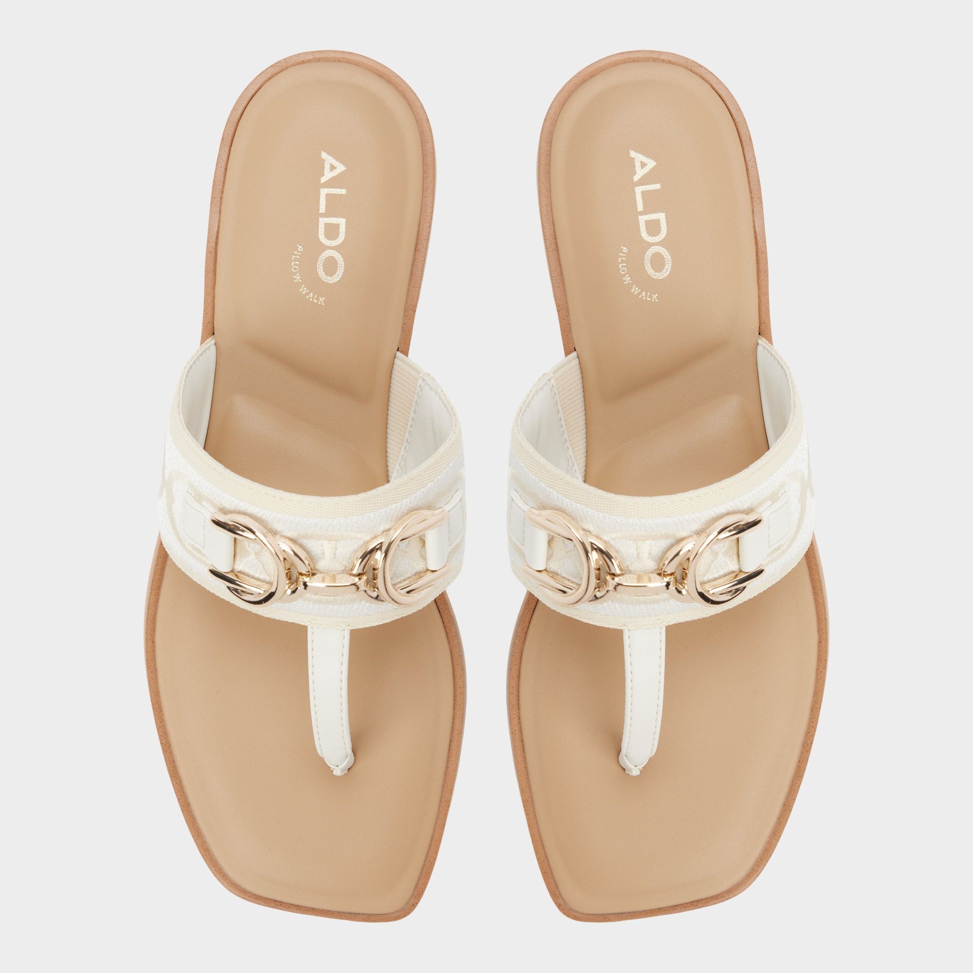 Top-down view of the White/Bone Coralynna T-strap sandal