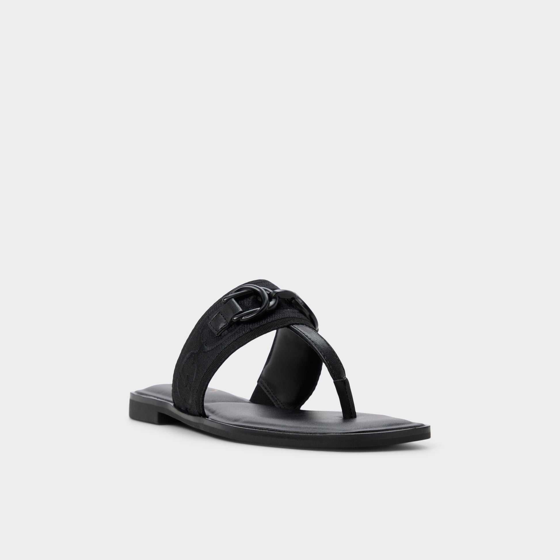 Three-quarter angle of Black Coralynna T-strap sandal's front side