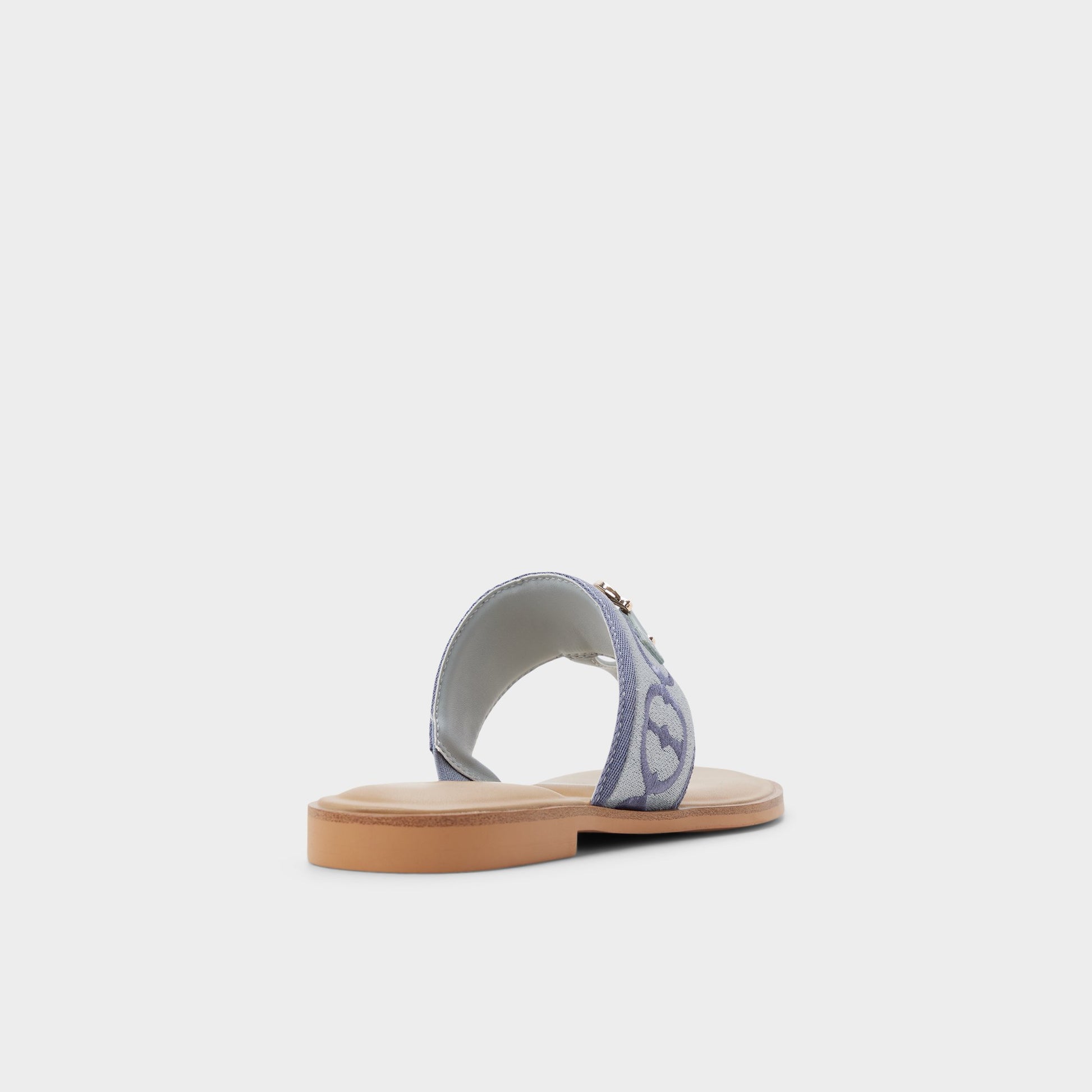 Three-quarter angle of Other Blue Coralynna T-strap sandal's back side