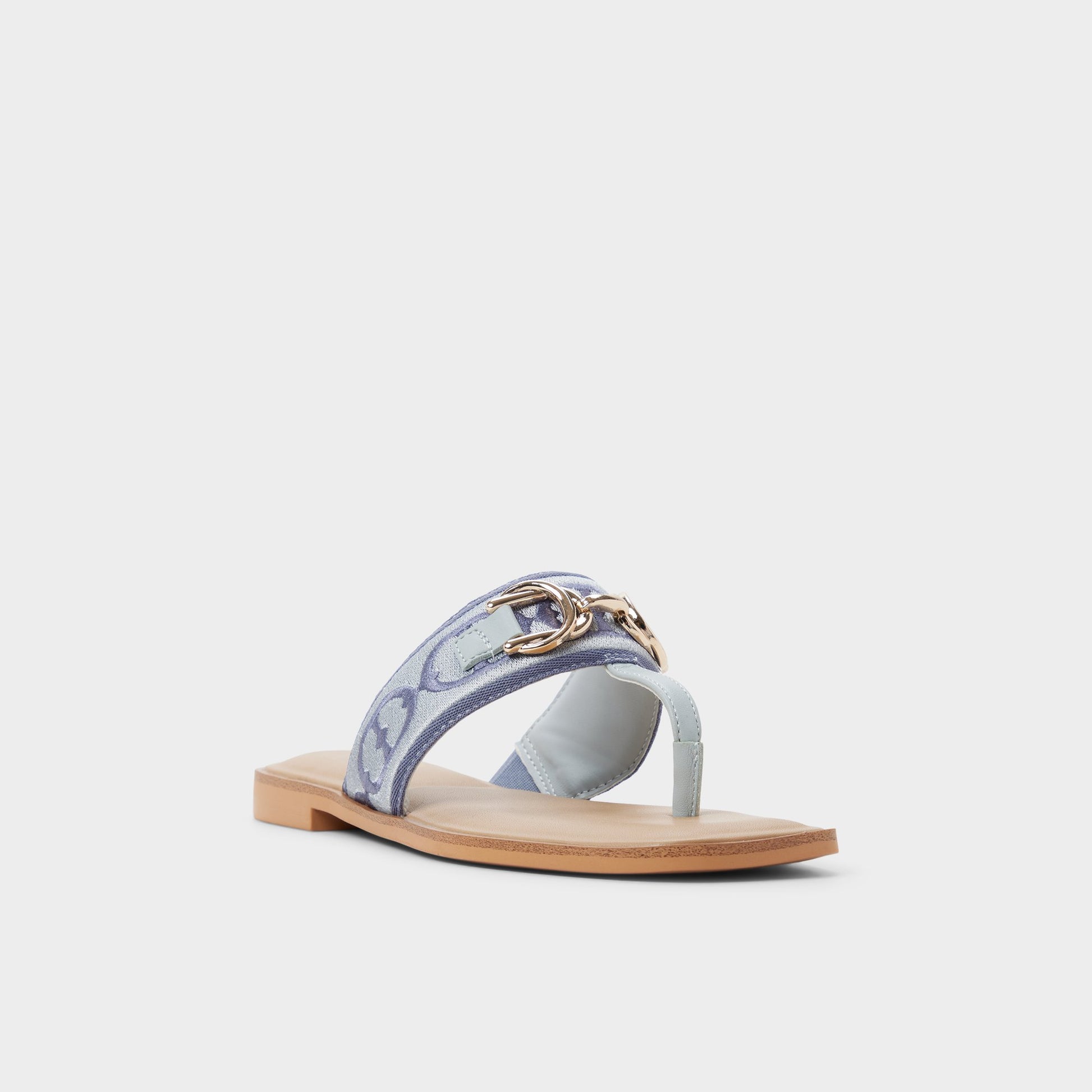 Three-quarter angle of Other Blue Coralynna T-strap sandal's front side