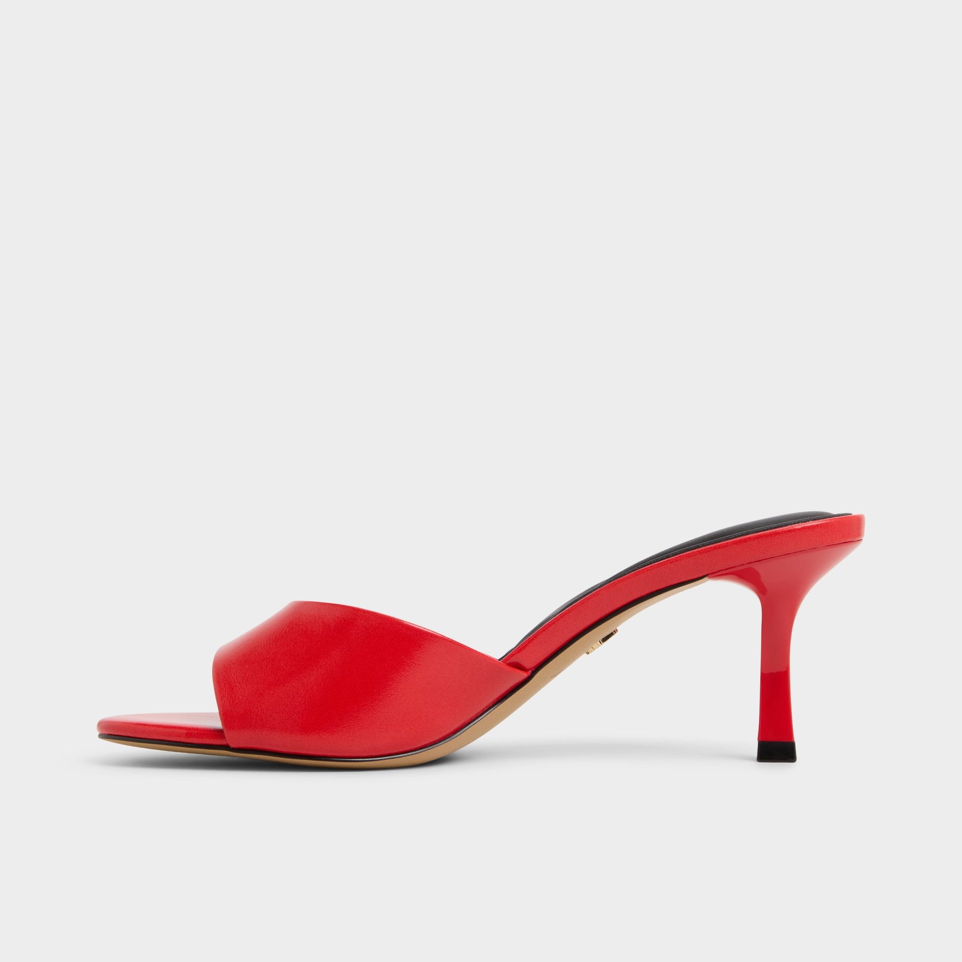 Side view of Bright red Annaberaen Heeled mule