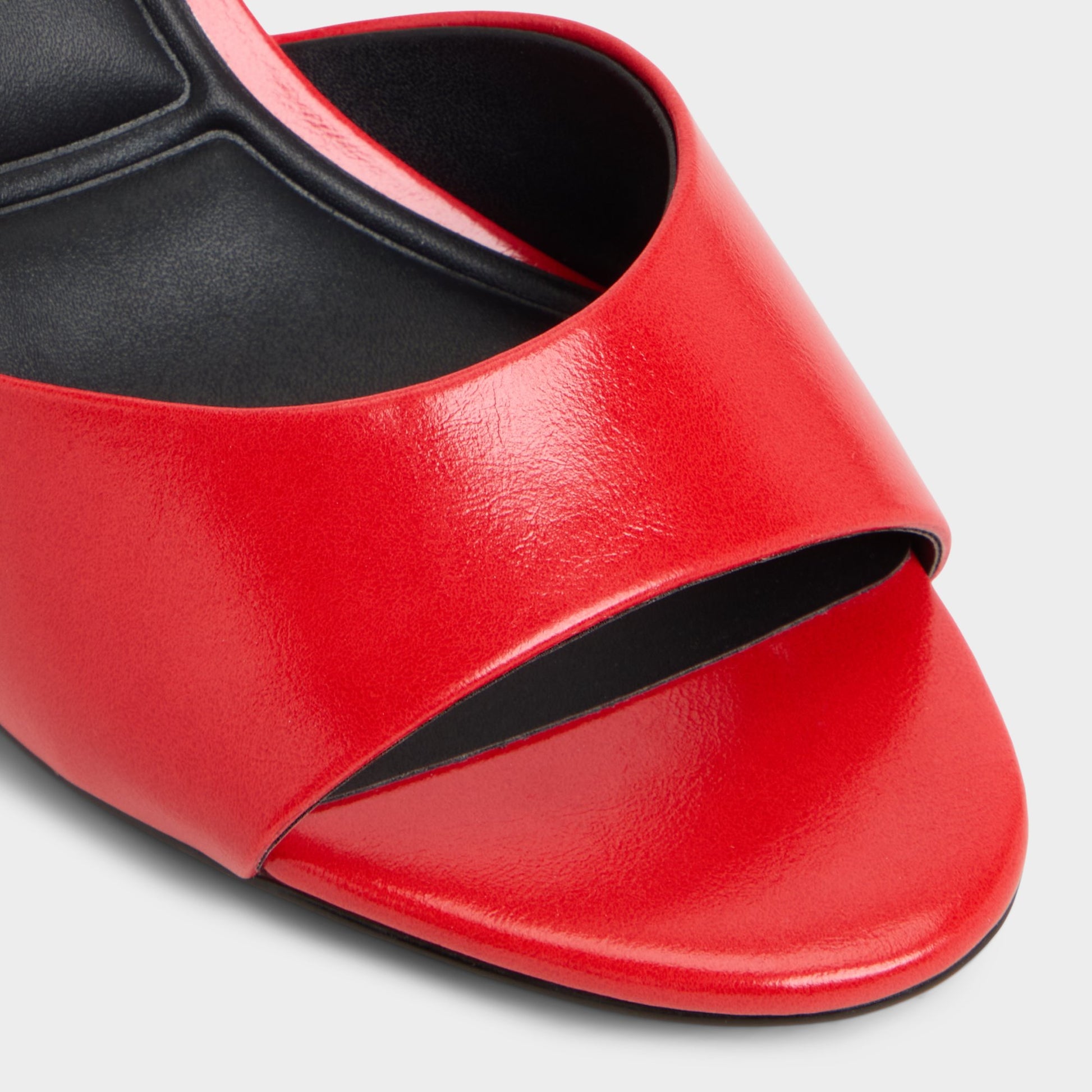 Close-up of the Bright red Annaberaen Heeled mule