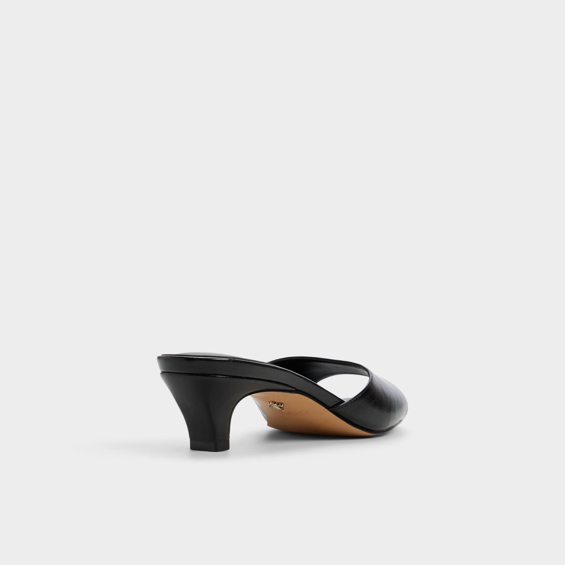 Three-quarter angle of Black Haeden Heeled mule's back side