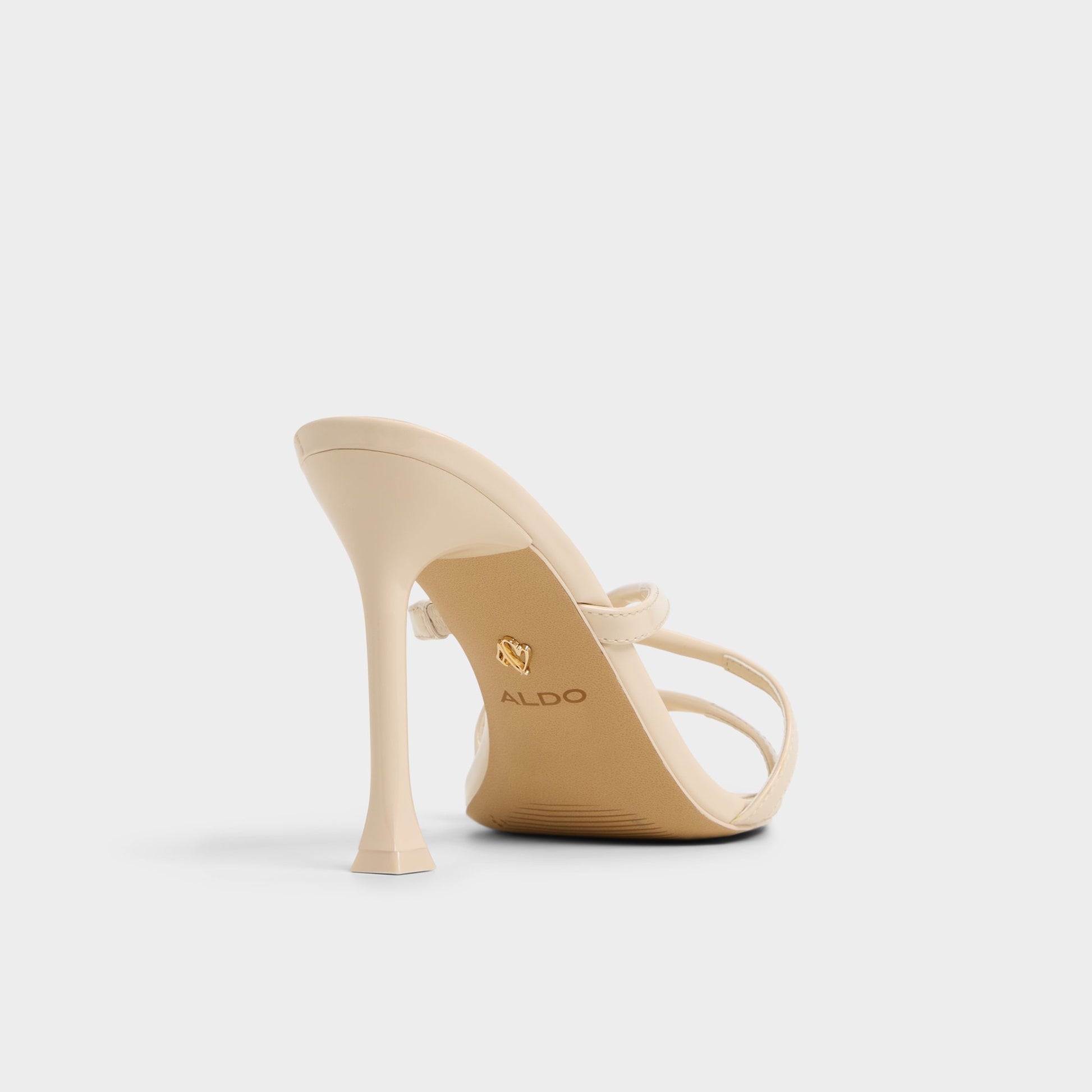 Three-quarter angle of Light Beige Velaia Heeled mule's back side