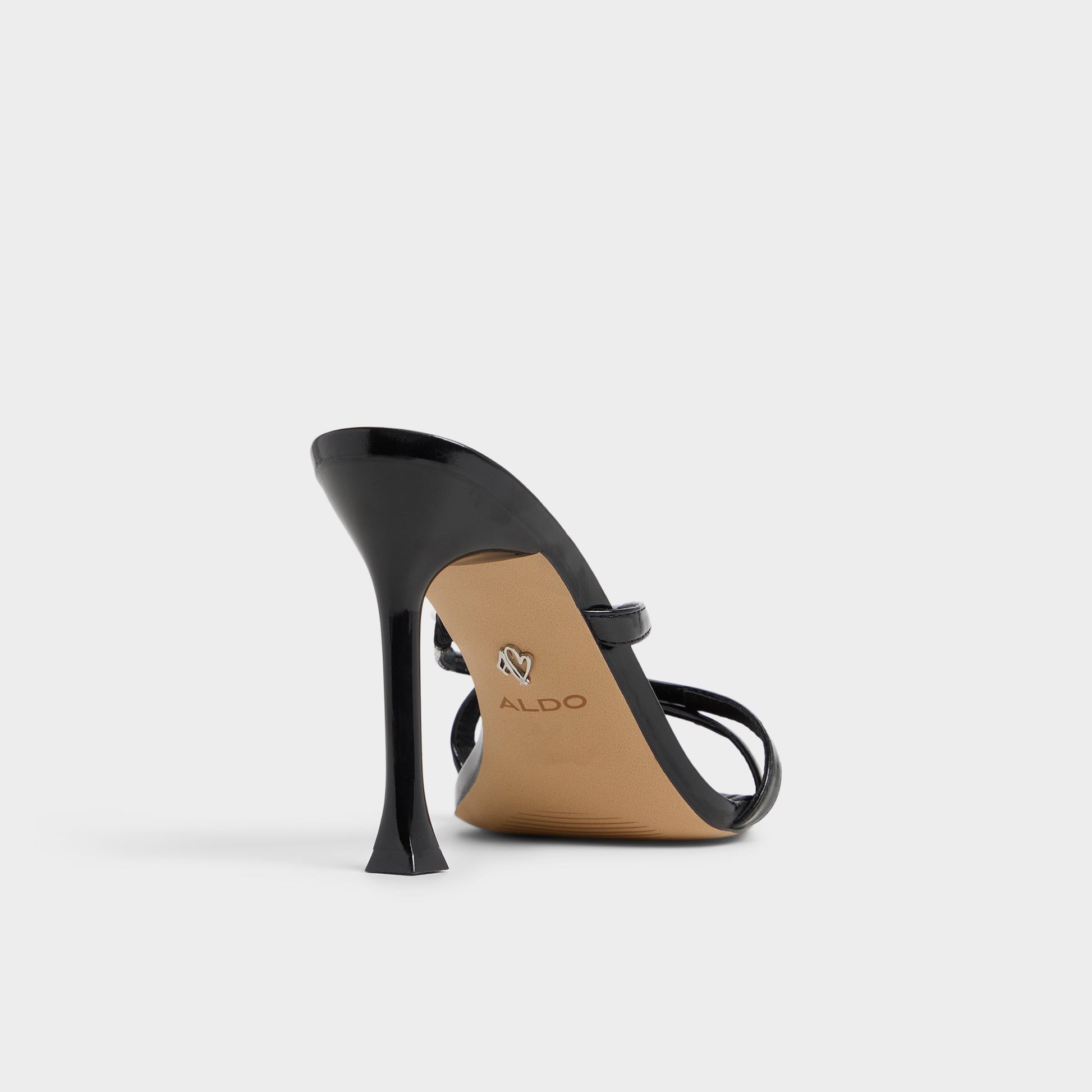 Three-quarter angle of Black Velaia Heeled mule's back side