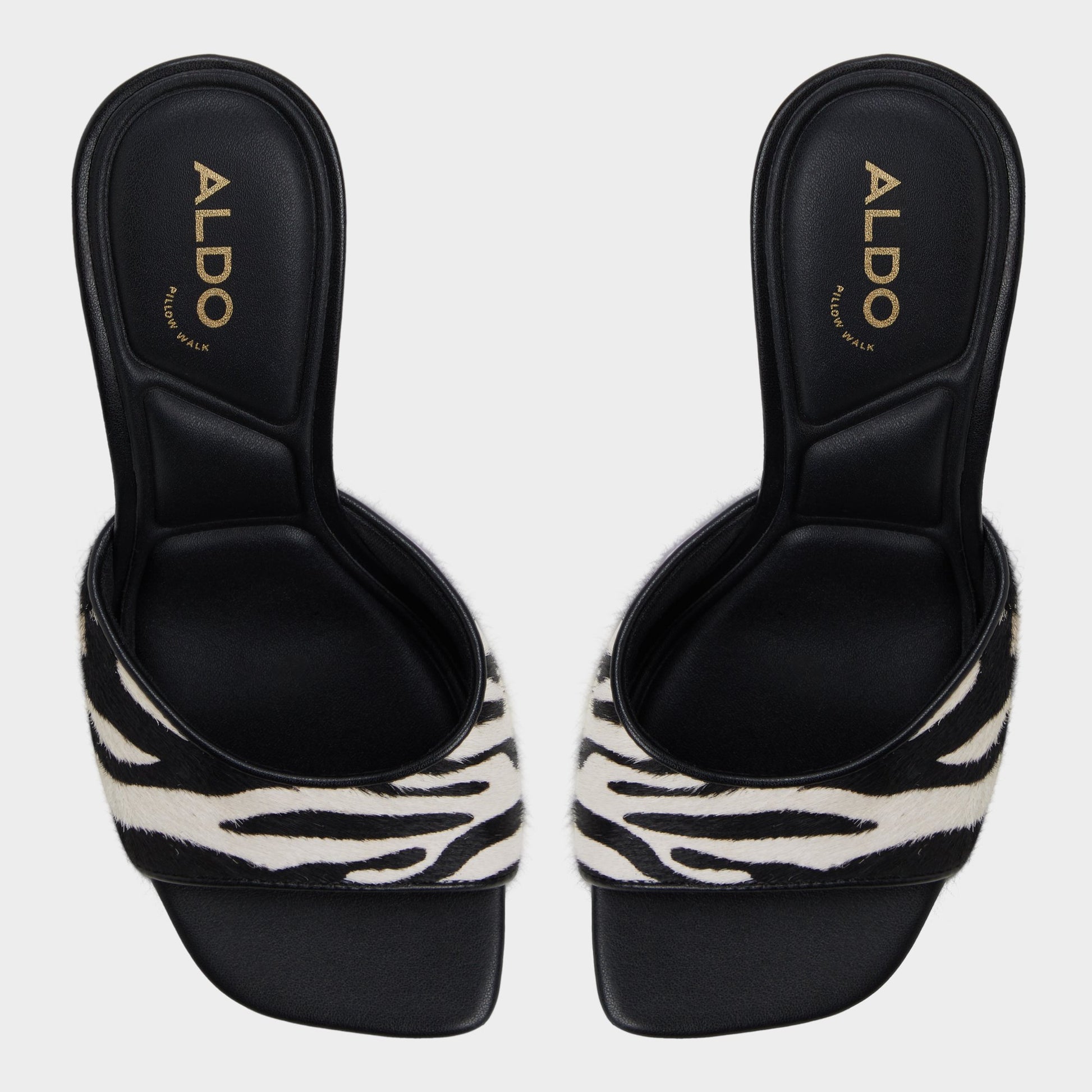 Top-down view of the White/Black Evadalia Heeled mule