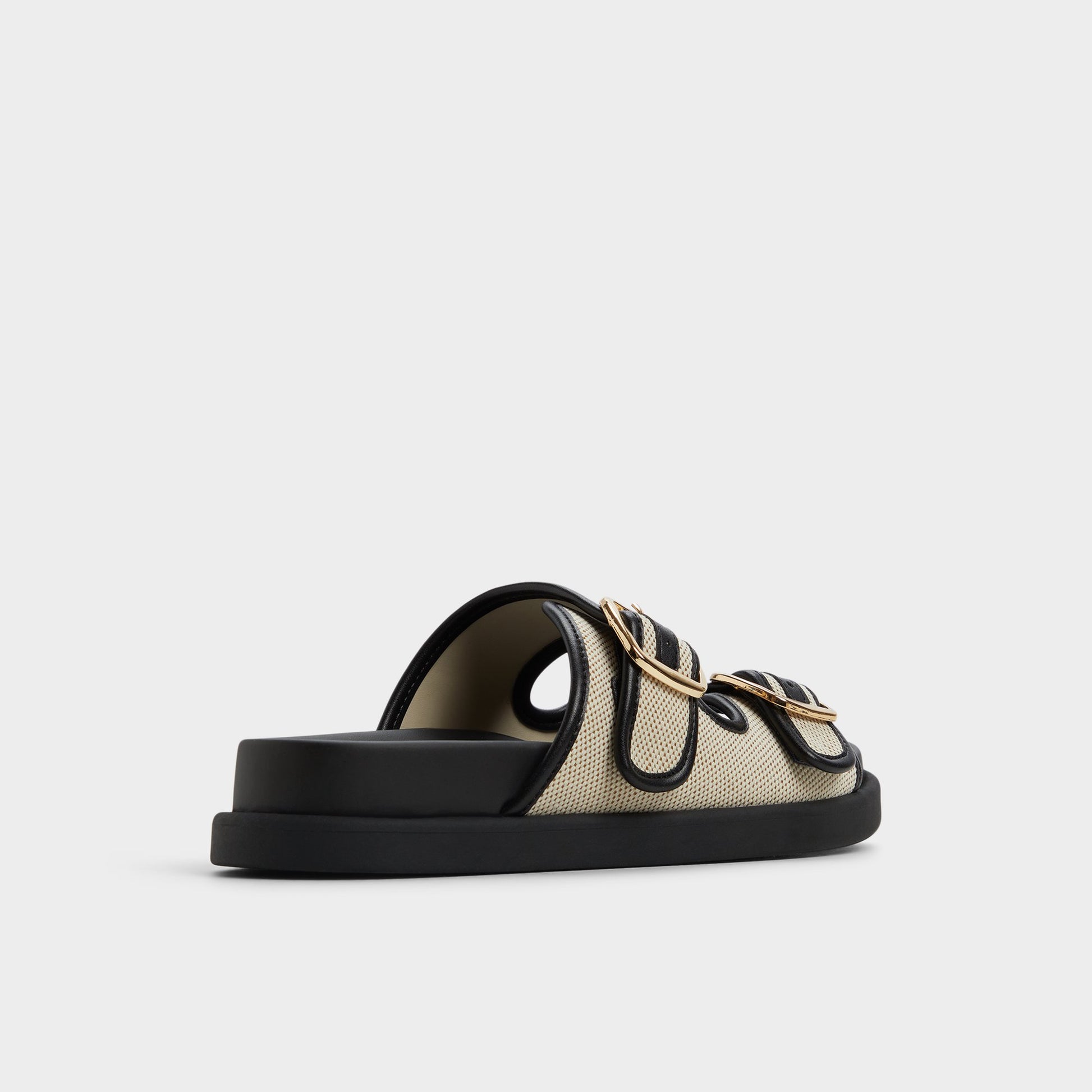 Three-quarter angle of Open natural Devanassi Footbed sandal's back side