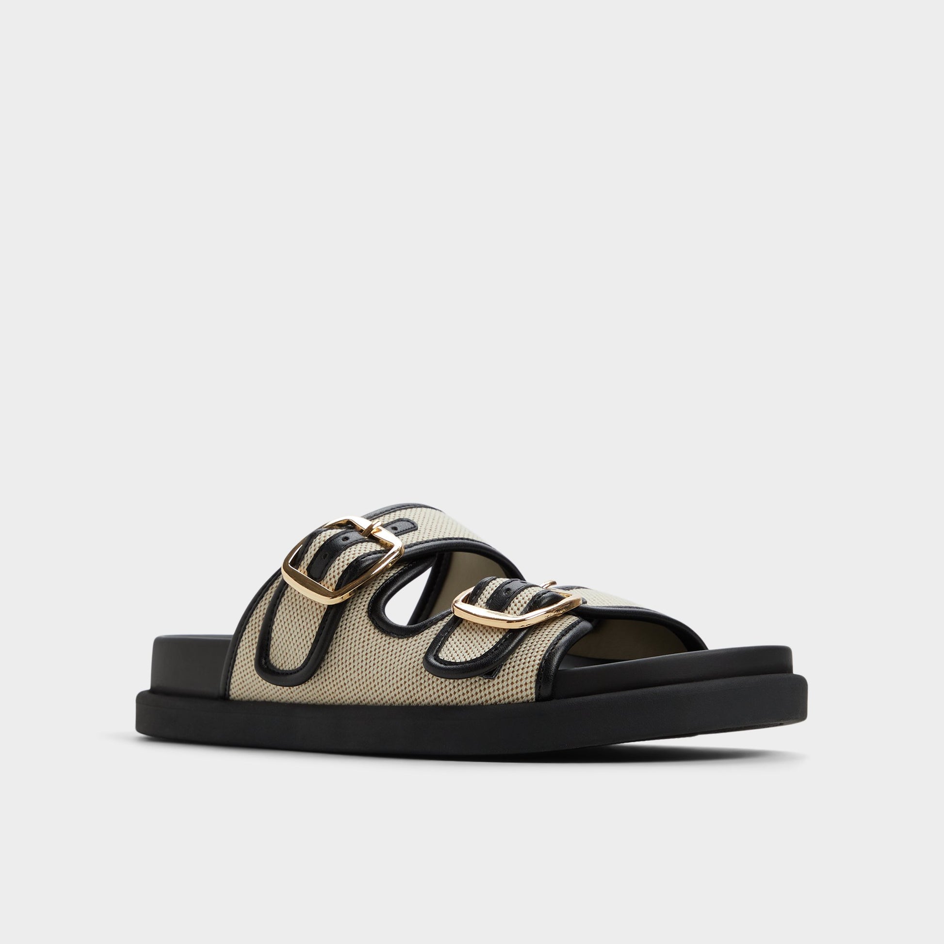 Three-quarter angle of Open natural Devanassi Footbed sandal's front side