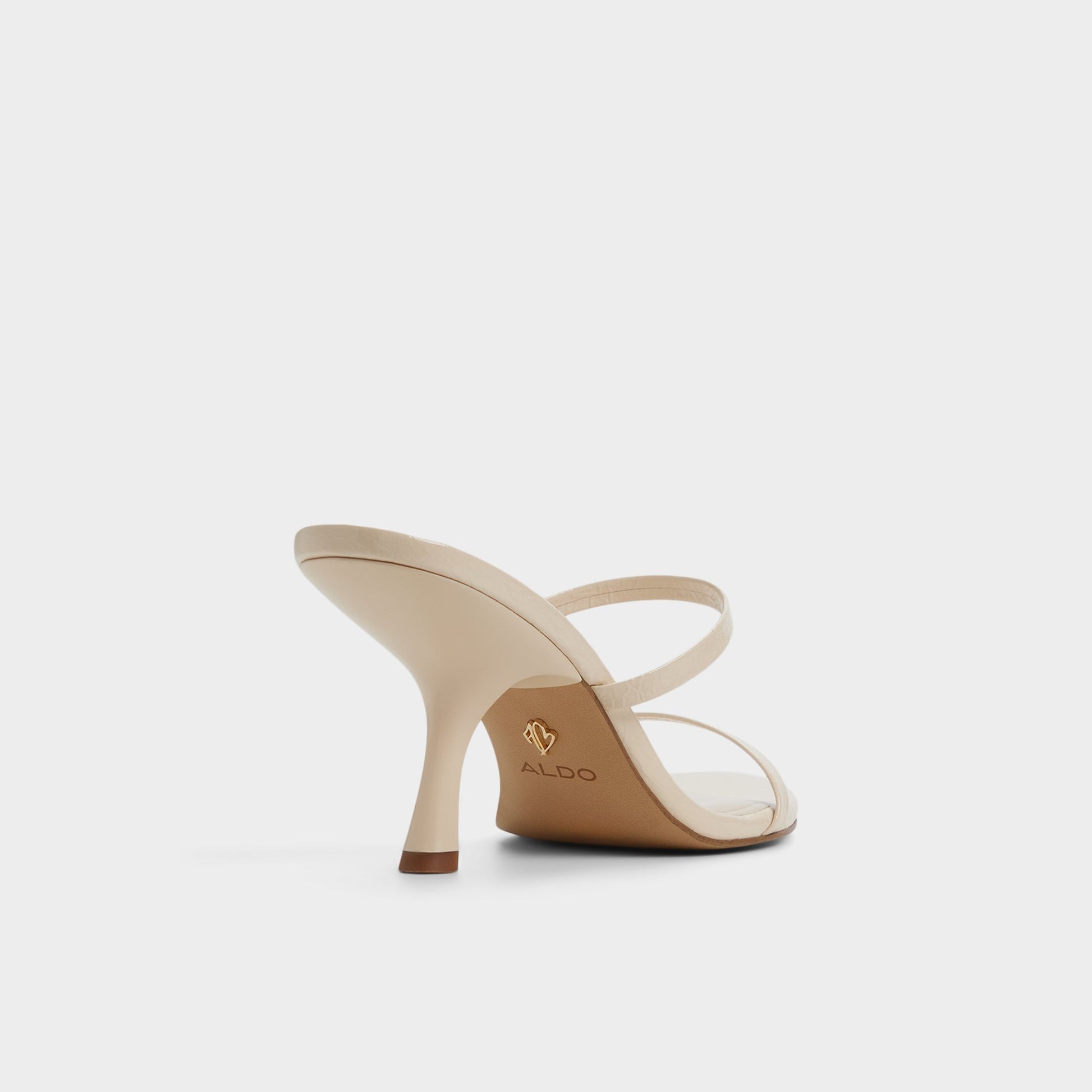 Three-quarter angle of Cream Avelinda Heeled mule's back side