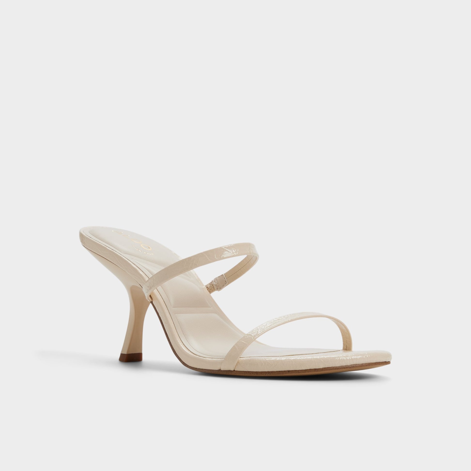 Three-quarter angle of Cream Avelinda Heeled mule's front side