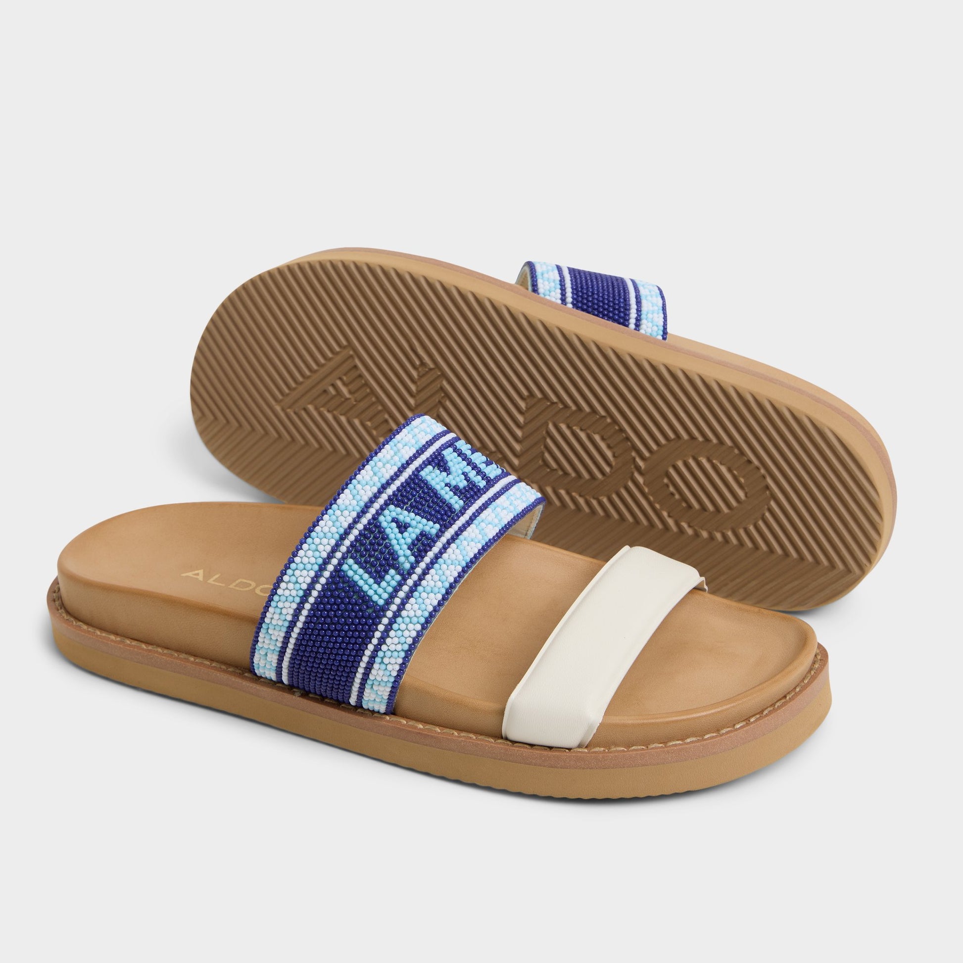 Vue en surbrillance d'une paire de Blanc/Bleu Beachvacay Claquette s