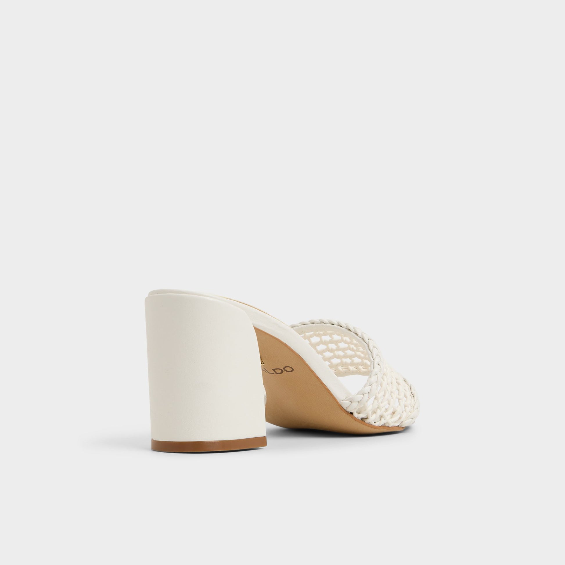 Three-quarter angle of White/Bone Beachdate Heeled mule's back side