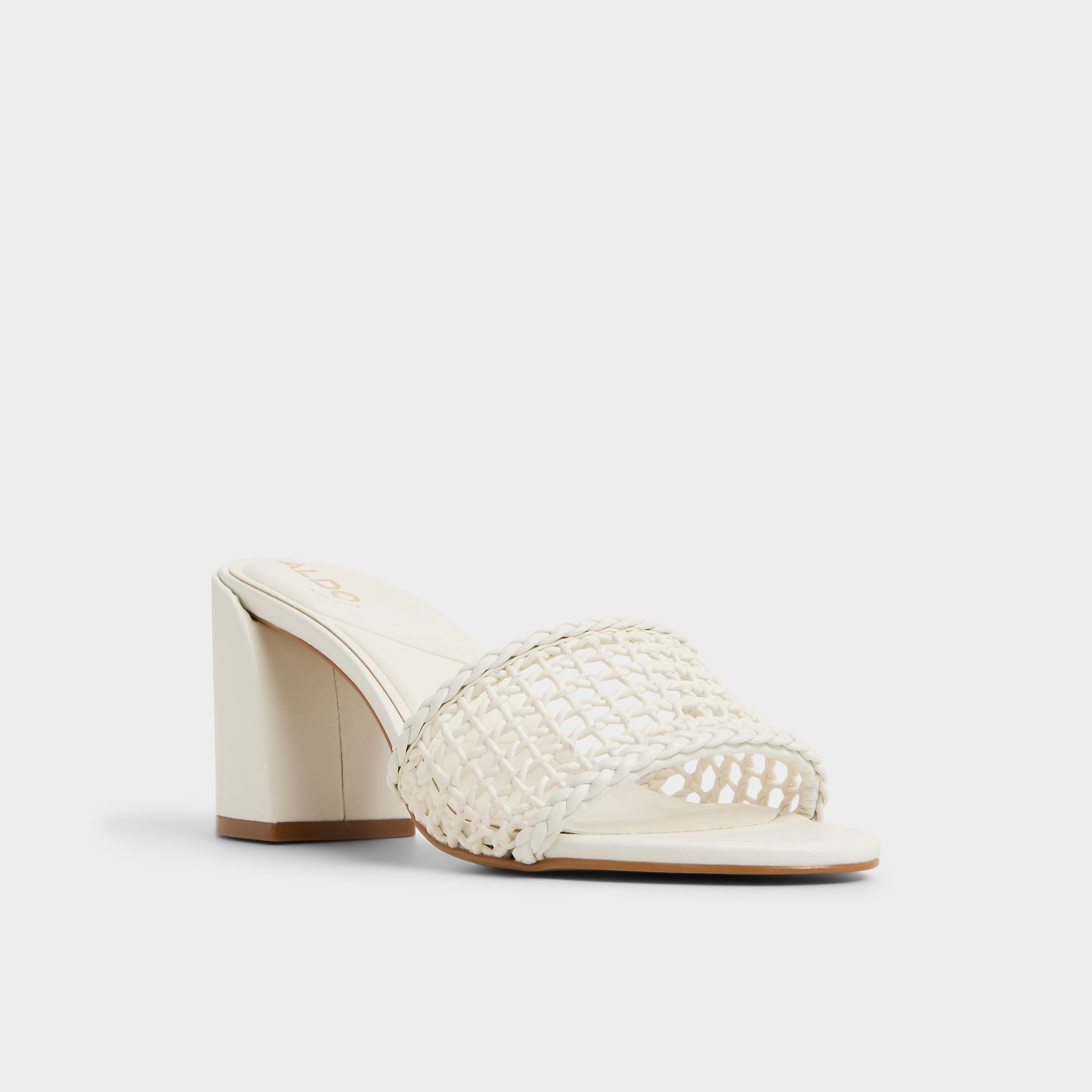 Three-quarter angle of White/Bone Beachdate Heeled mule's front side