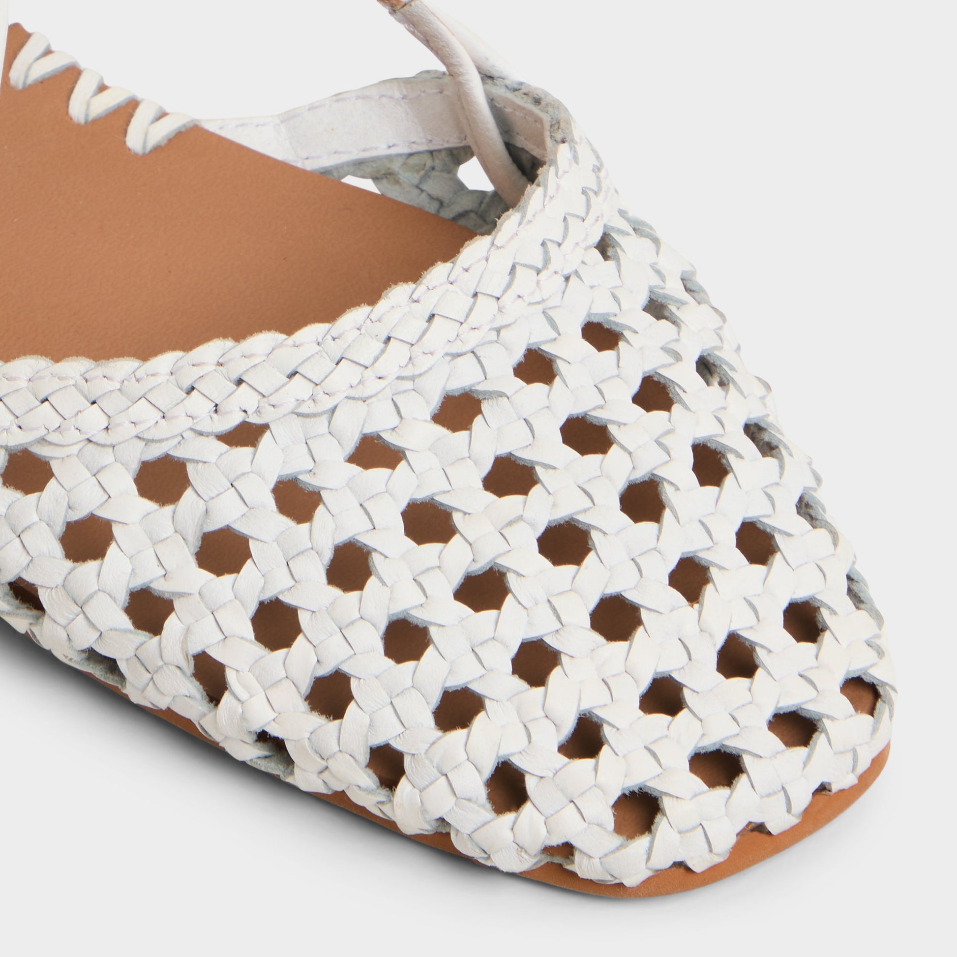 Close-up of the White/Bone Dragostee Strappy flat sandal