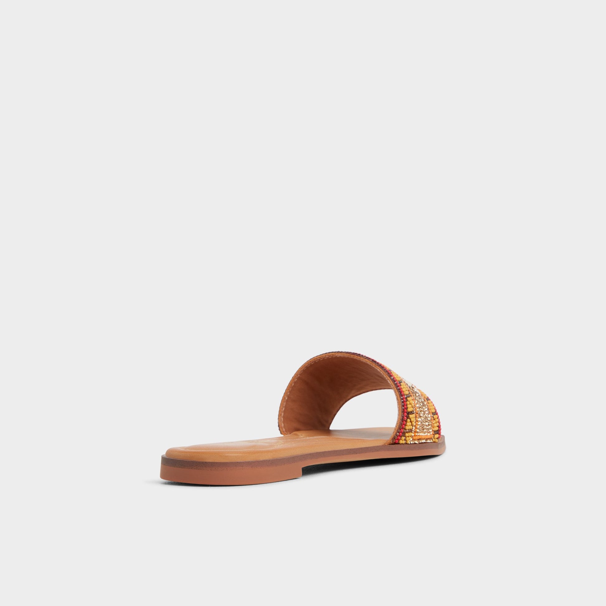 Three-quarter angle of Brown Multi Seavacay Slide sandal's back side