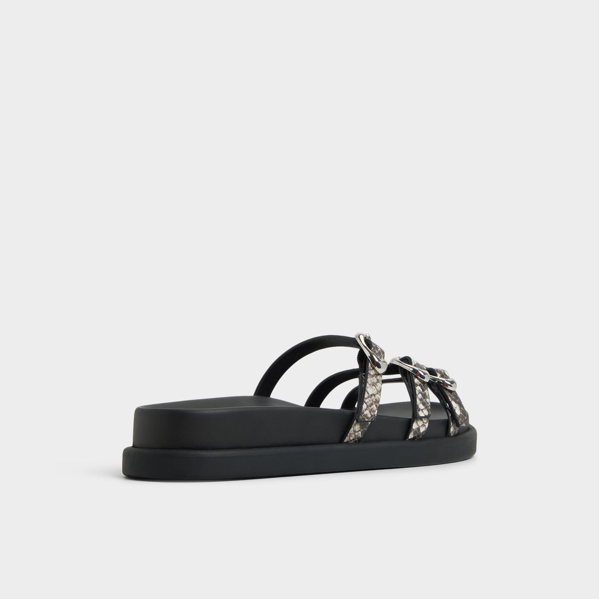 Three-quarter angle of White/Black Zephyra Footbed sandal's back side